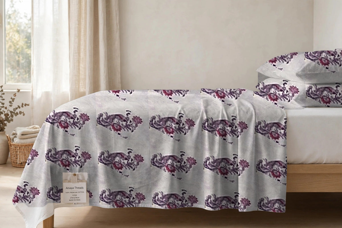 Mor Bagh Jamun bedsheet seen from the side, falling over the edge of the bed