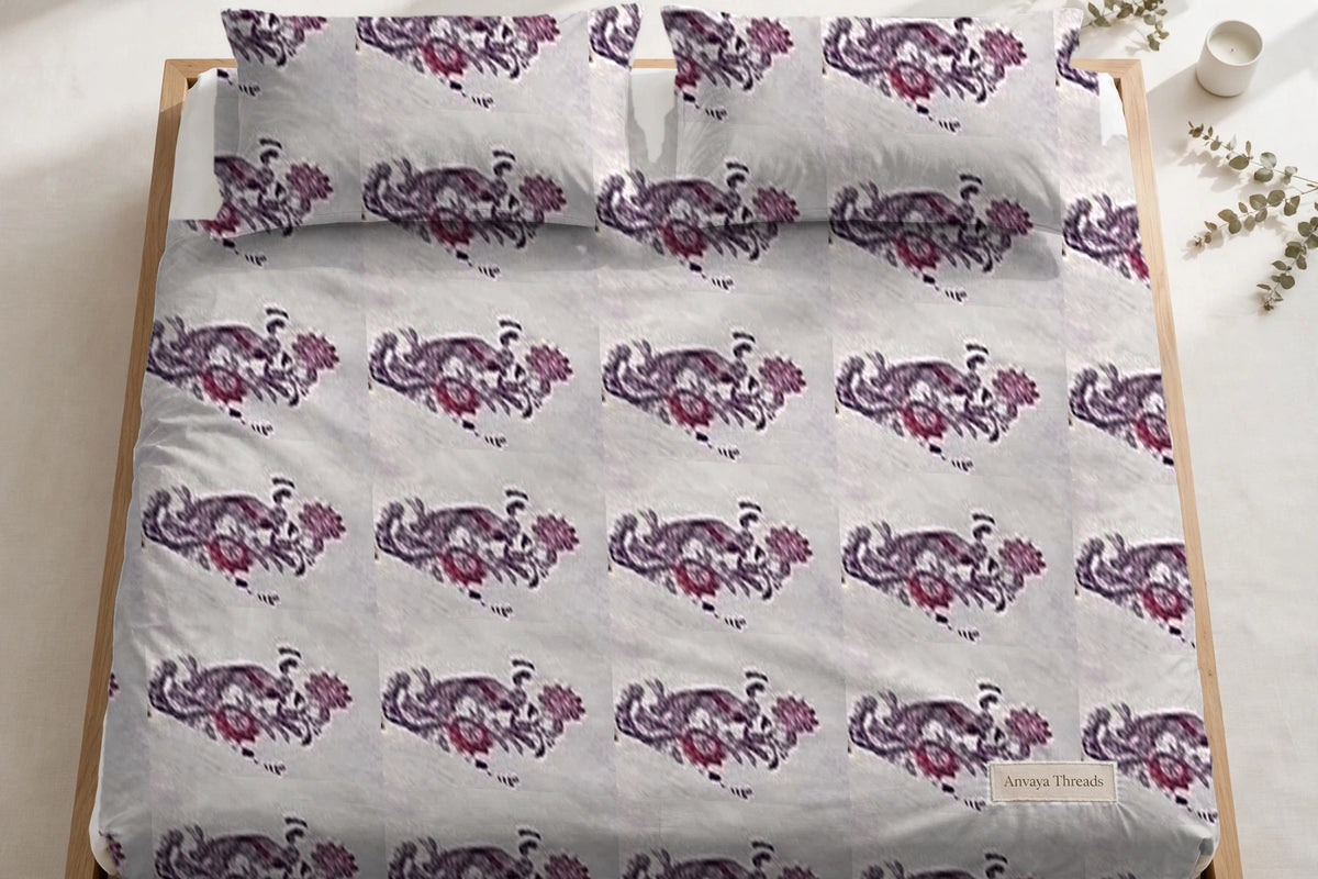 Mor Bagh Jamun bedsheet seen from above, with the pillow covers at the head of the bed