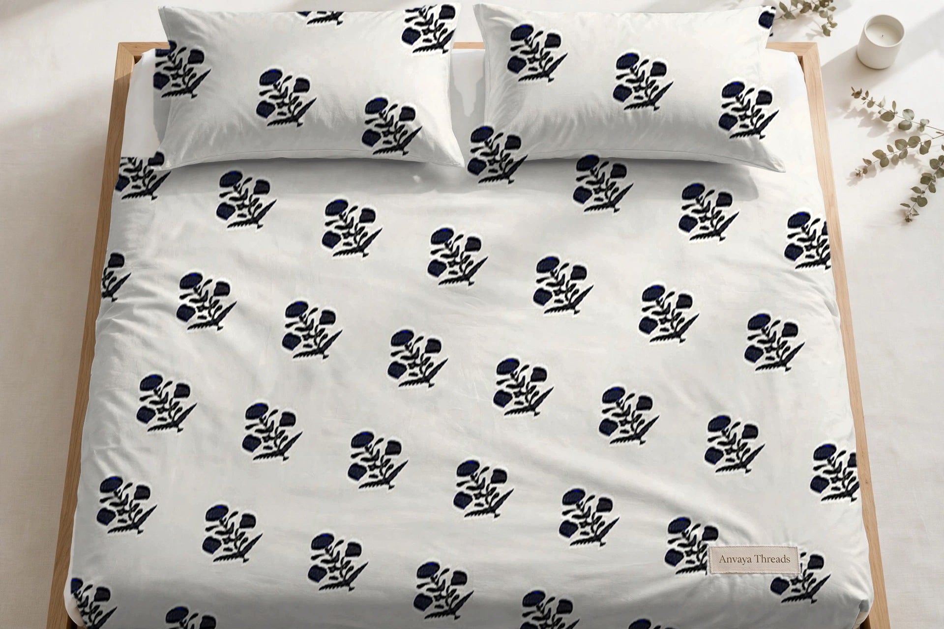 Phool Booti Kaala bedsheet seen from above, with the pillow covers at the head of the bed