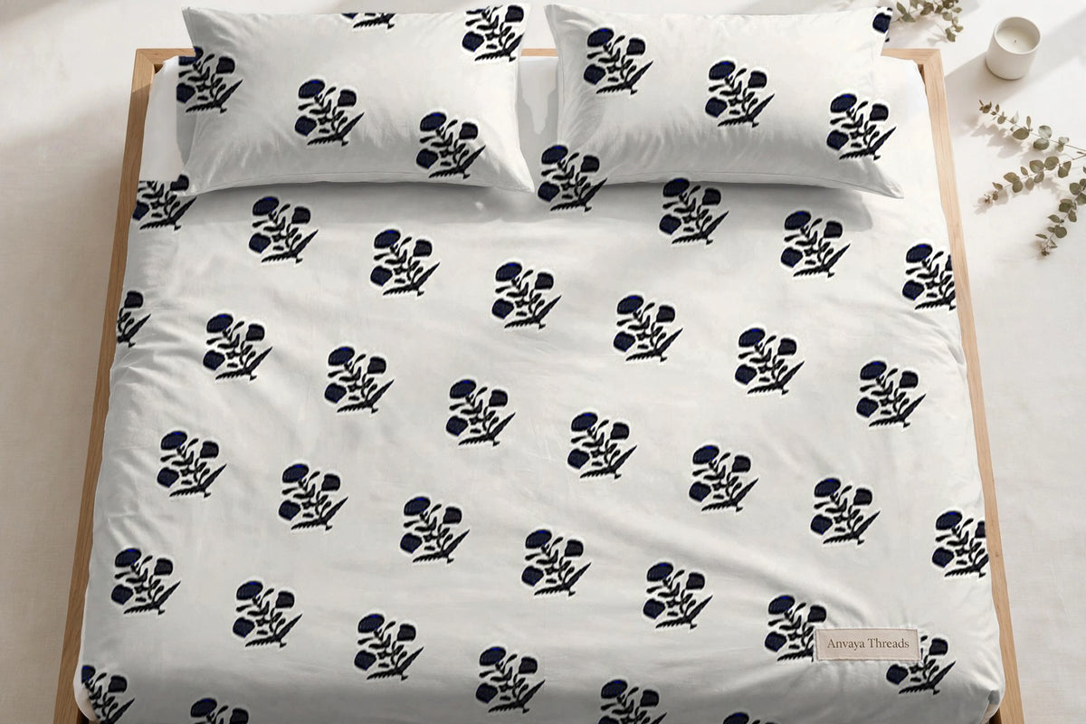 Phool Booti Kaala bedsheet seen from above, with the pillow covers at the head of the bed