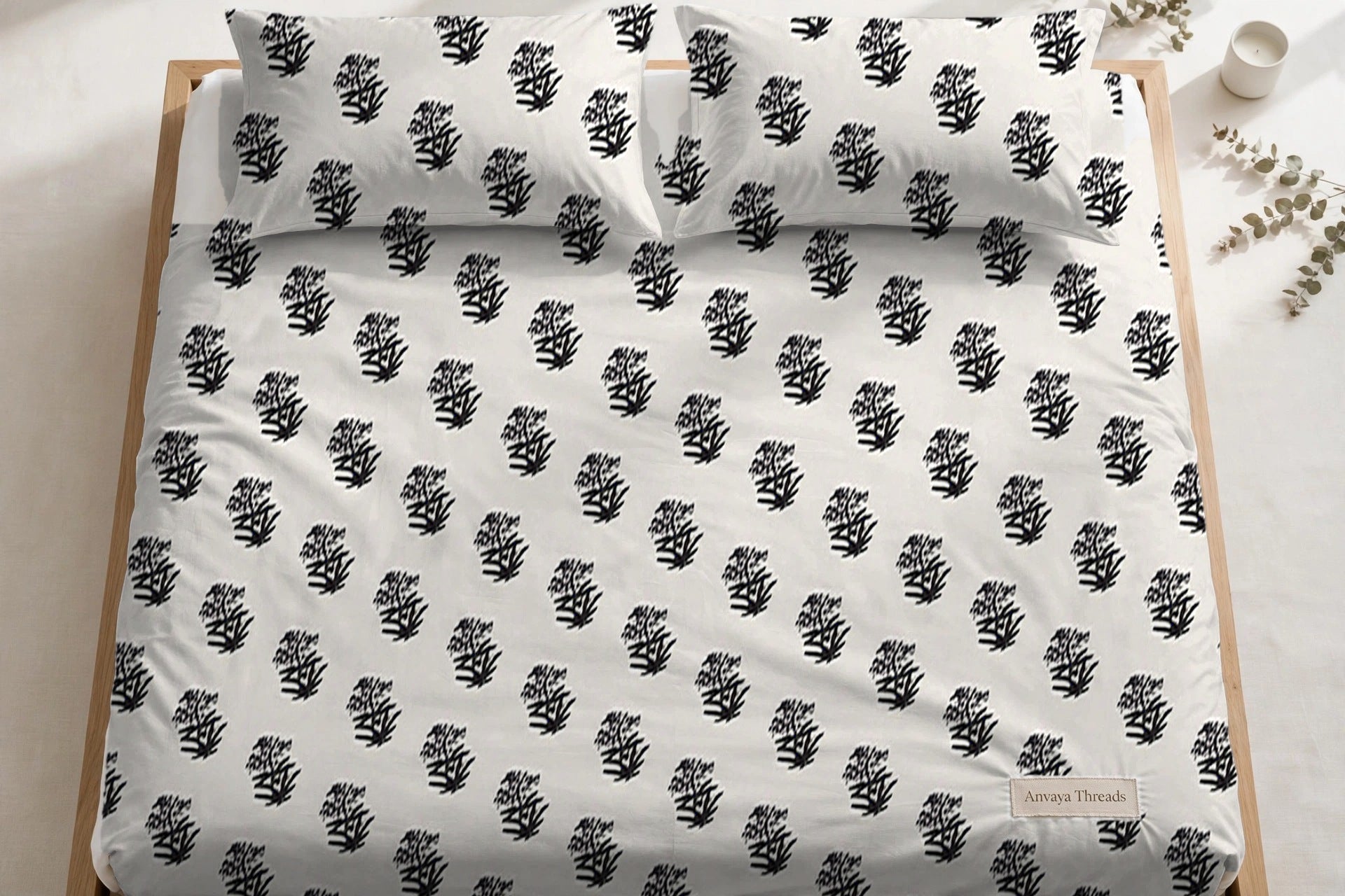 Jhaad Booti Surmai bedsheet seen from above, with the pillow covers at the head of the bed
