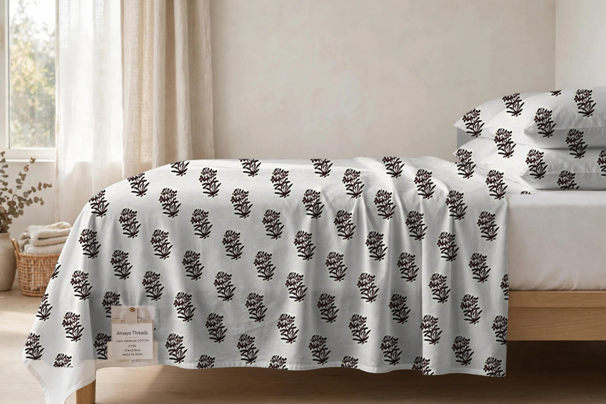 Jhaad Booti Kaapi bedsheet seen from the side, falling over the edge of the bed