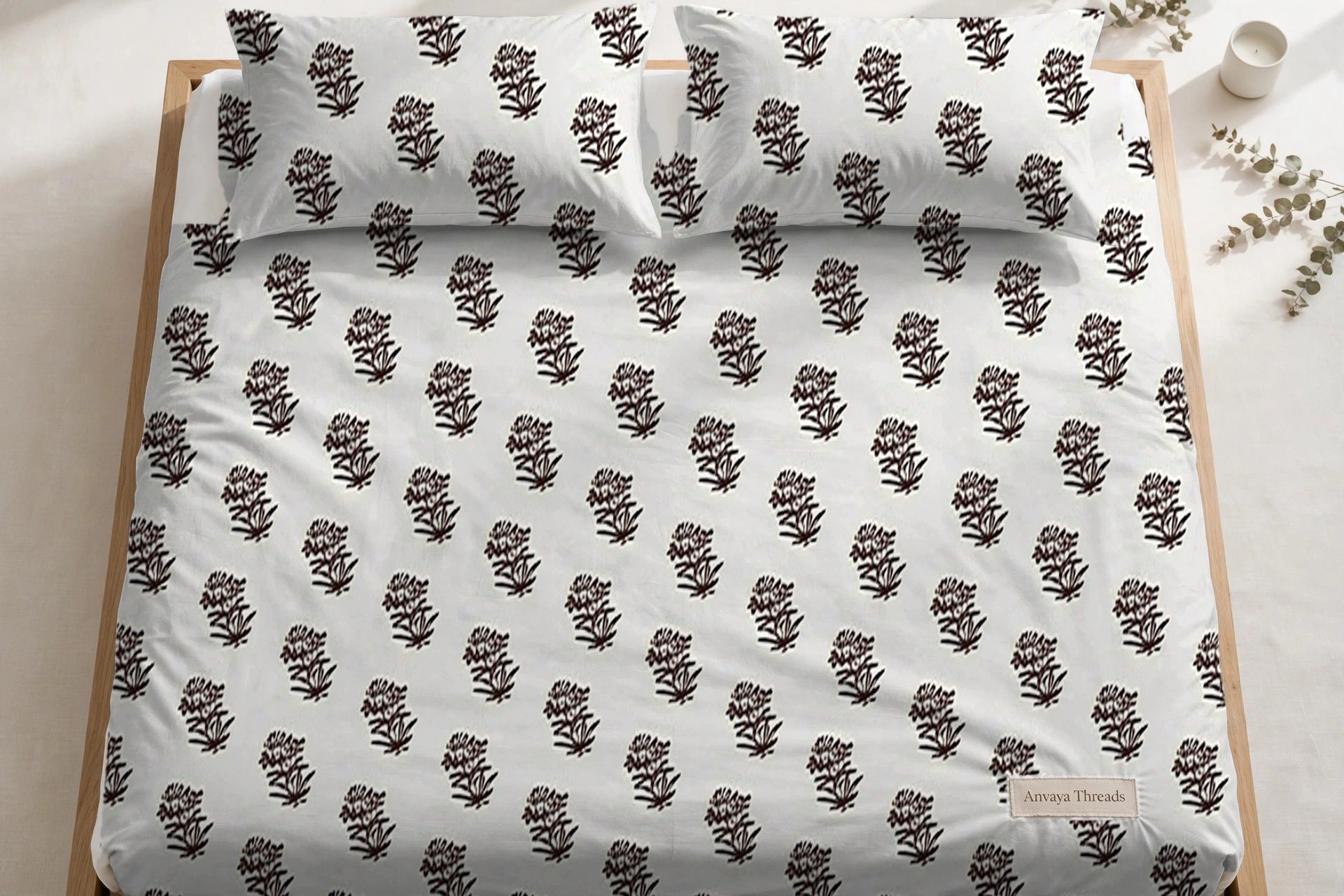 Jhaad Booti Kaapi bedsheet seen from above, with the pillow covers at the head of the bed