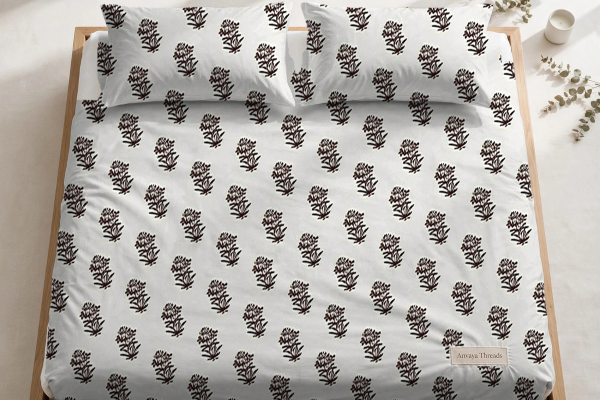 Jhaad Booti Kaapi bedsheet seen from above, with the pillow covers at the head of the bed