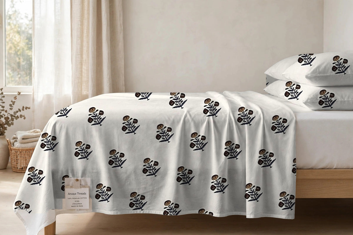 Kali Booti Sona bedsheet seen from the side, falling over the edge of the bed