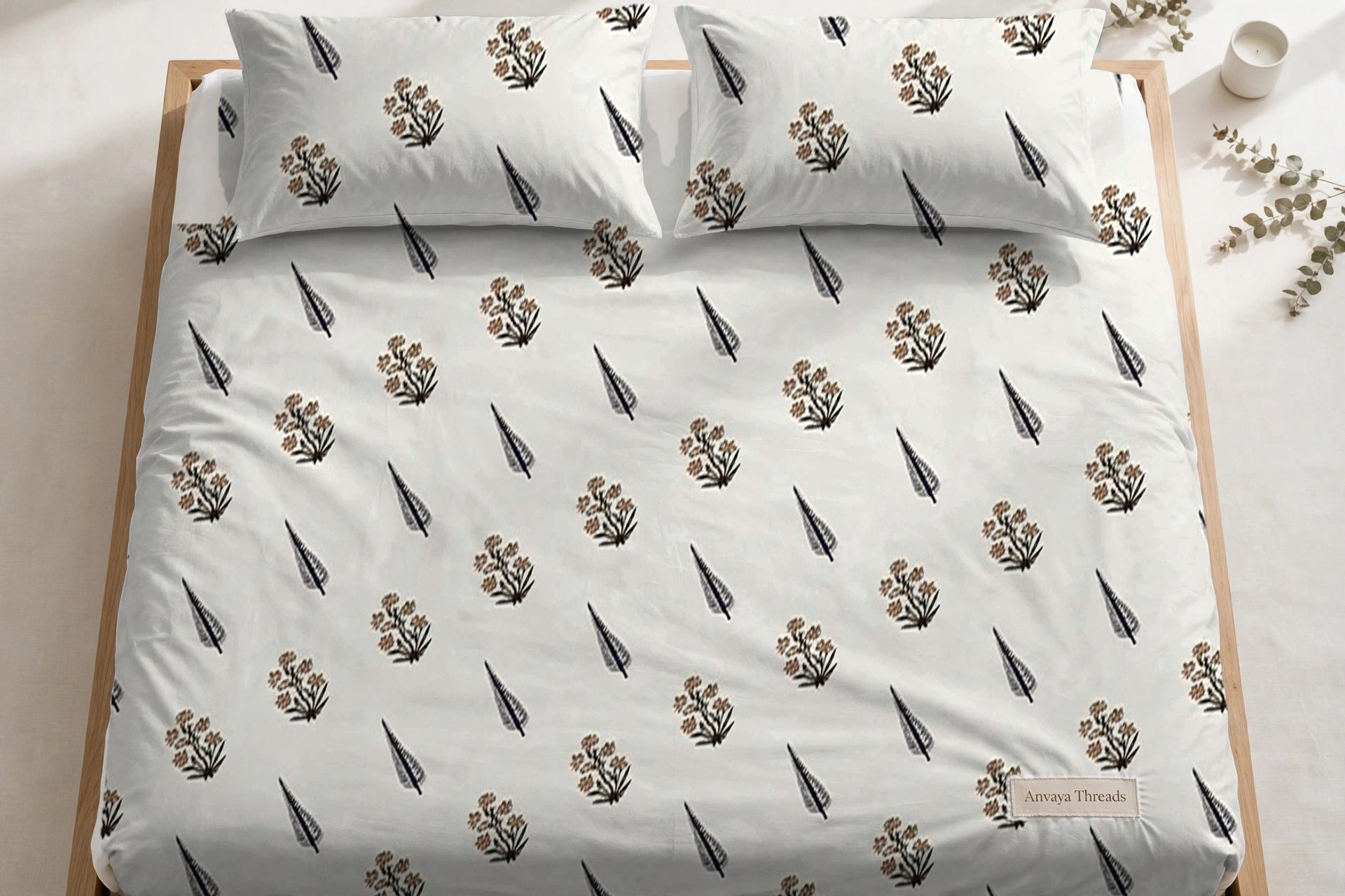 Sarv Booti Kaala bedsheet seen from above, with the pillow covers at the head of the bed