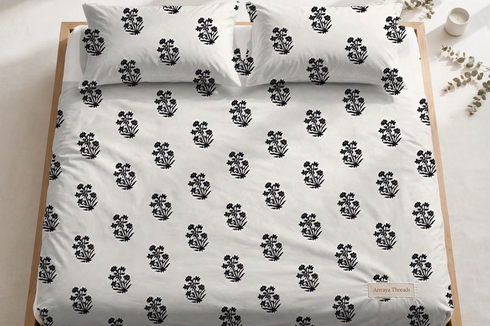 Sarv Booti Neel bedsheet seen from above, with the pillow covers at the head of the bed