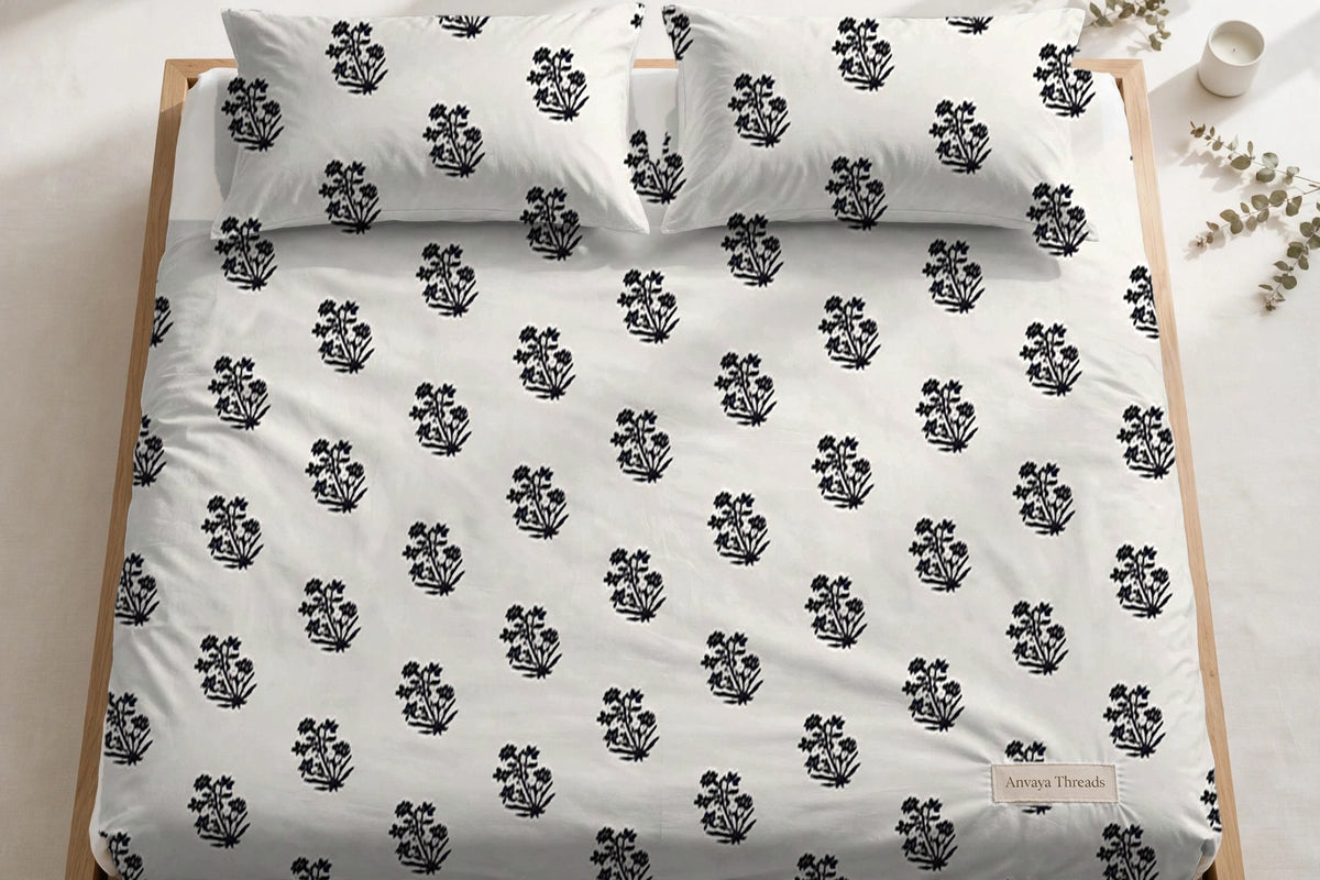 Sarv Booti Neel bedsheet seen from above, with the pillow covers at the head of the bed