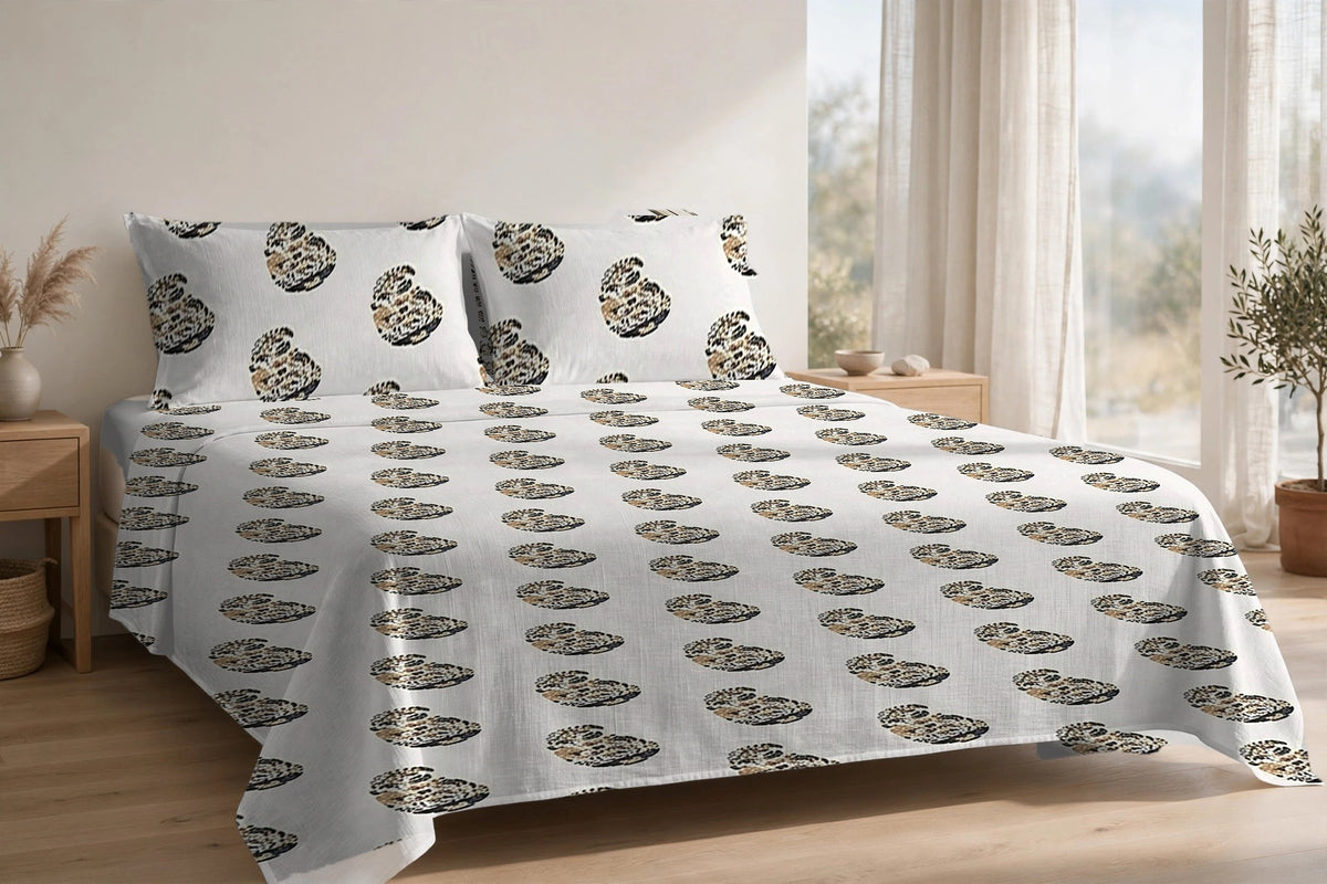 Keri Sona cotton bedsheet on a made king bed, with matching pillow covers