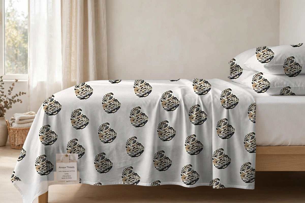 Keri Sona bedsheet seen from the side, falling over the edge of the bed