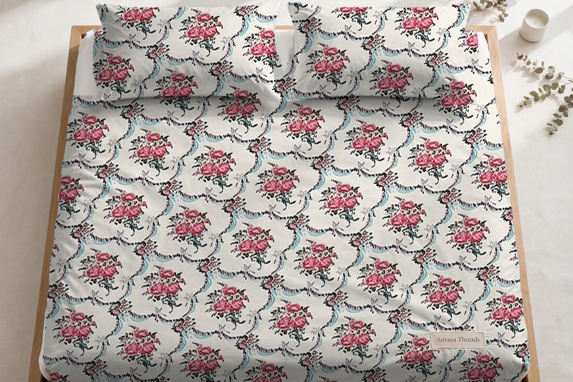 Khajoor Jaal Gulab bedsheet seen from above, with the pillow covers at the head of the bed