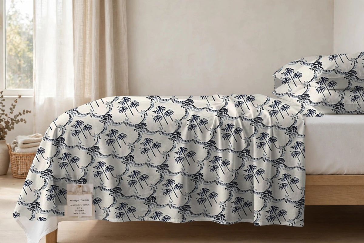 Khajoor Jaal Surmai bedsheet seen from the side, falling over the edge of the bed