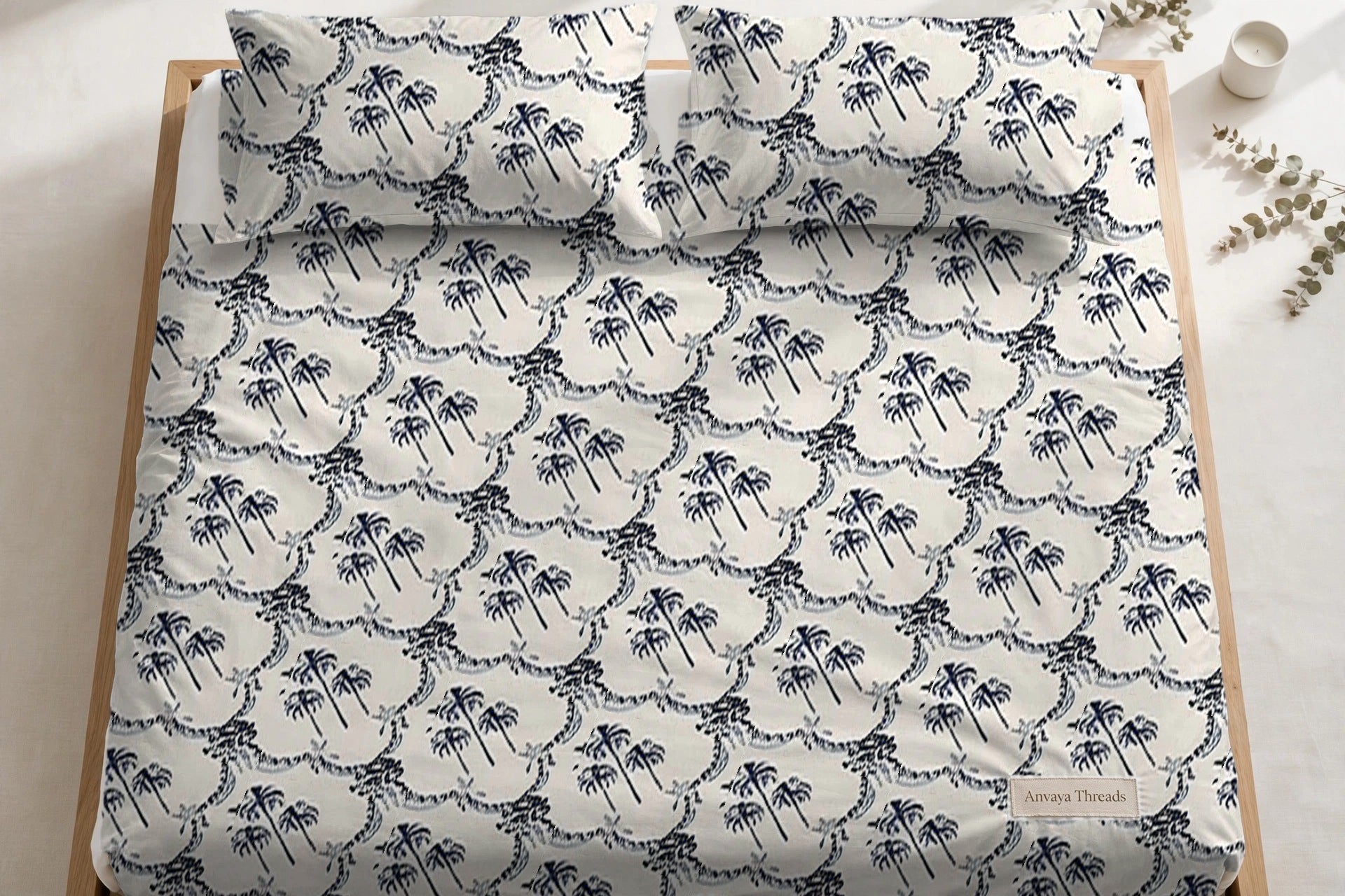 Khajoor Jaal Surmai bedsheet seen from above, with the pillow covers at the head of the bed