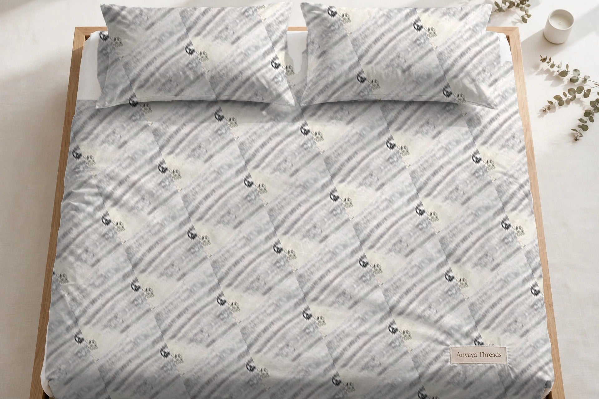 Dhaari Phool Kajal bedsheet seen from above, with the pillow covers at the head of the bed