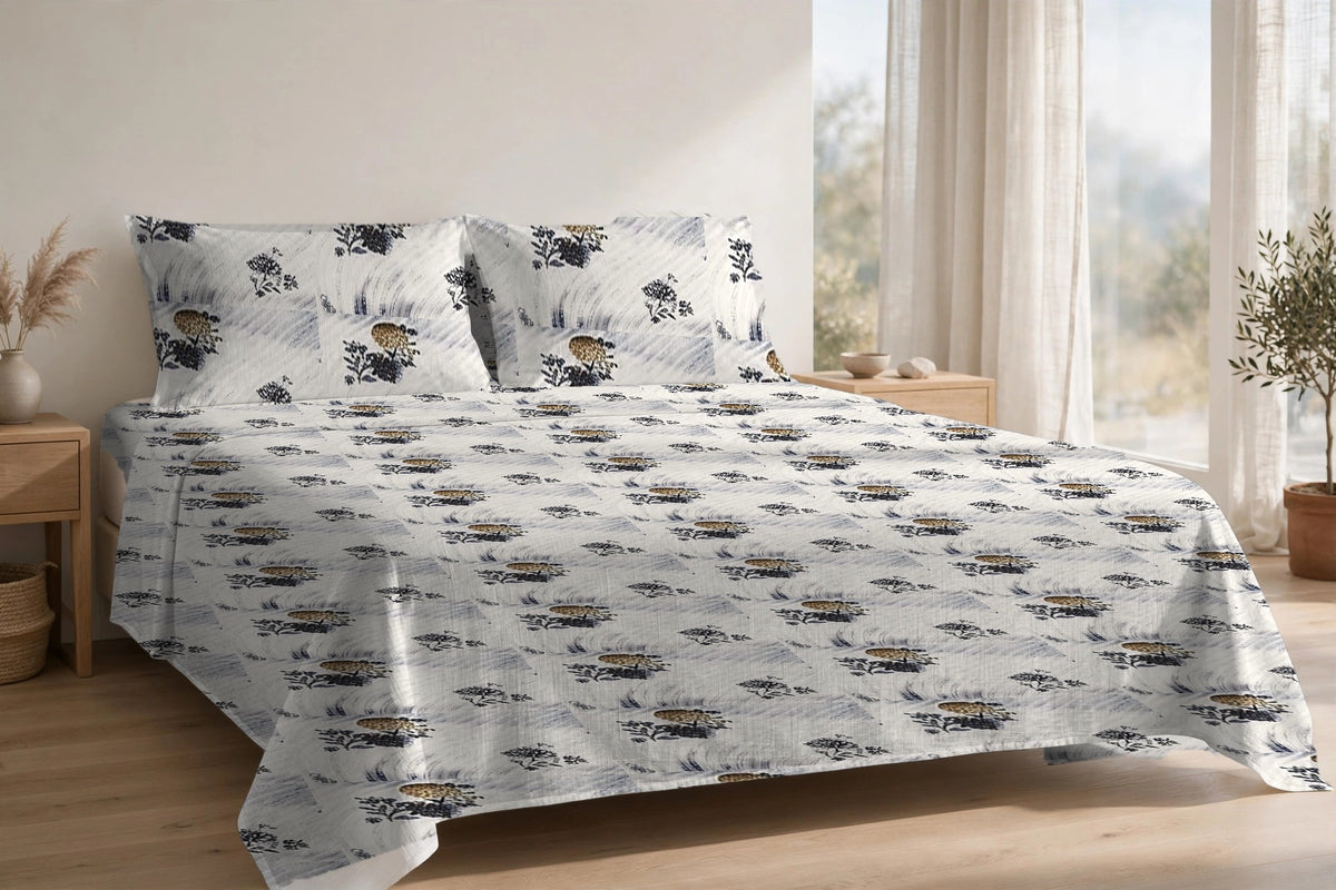 Dhaari Phool Neel cotton bedsheet on a made king bed, with matching pillow covers