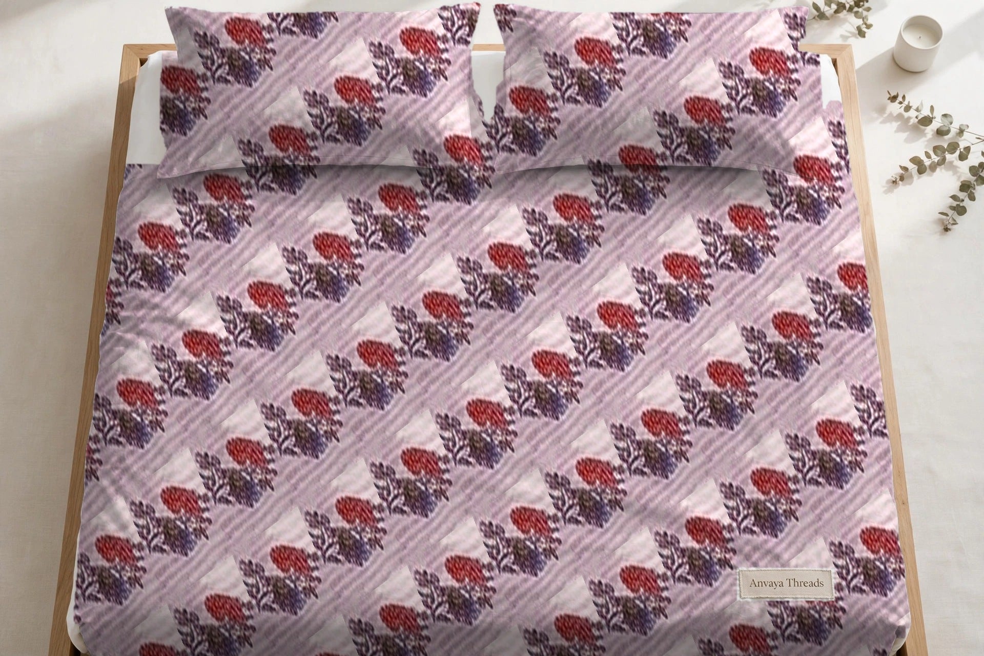 Dhaari Phool Gulab bedsheet seen from above, with the pillow covers at the head of the bed