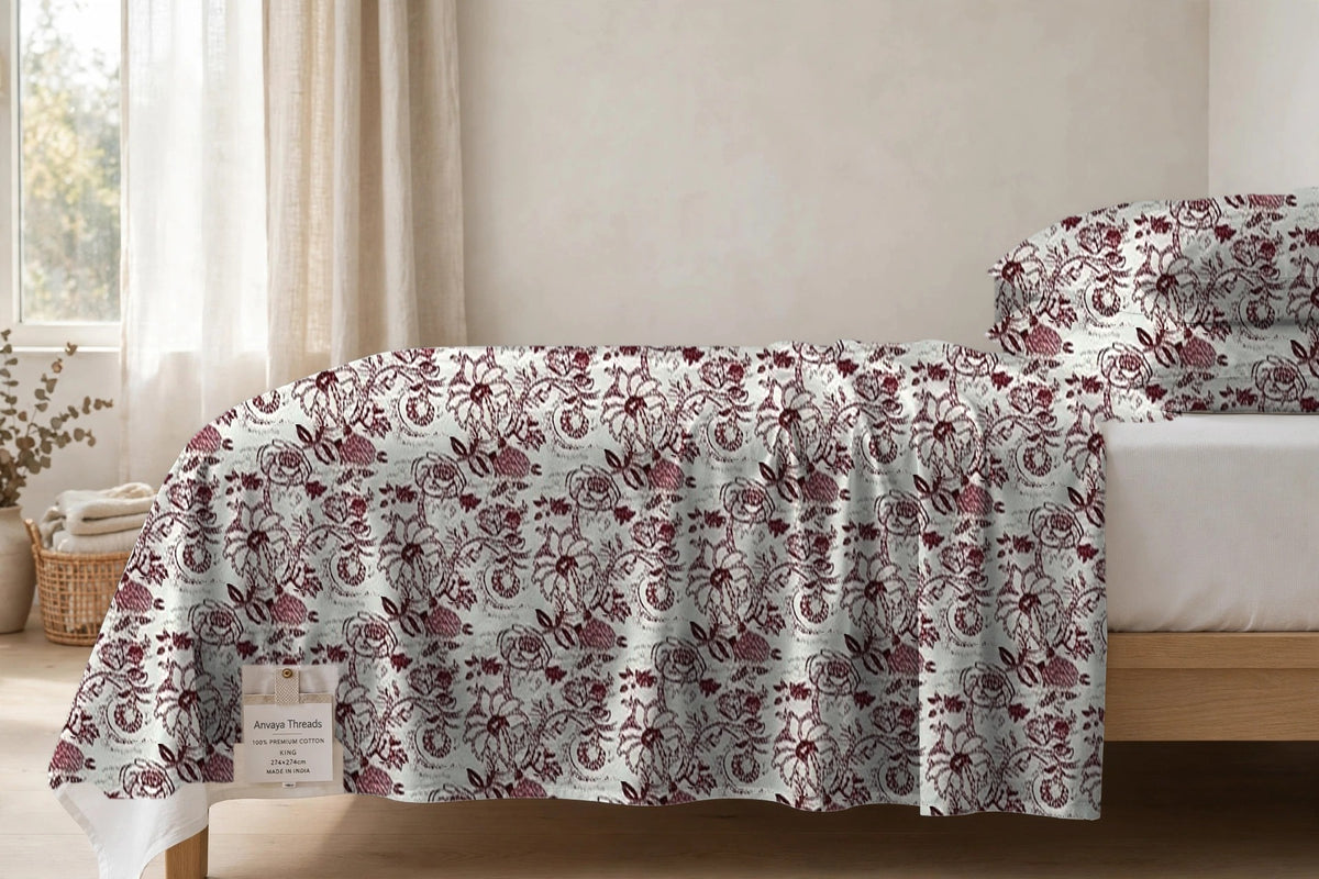 Rani Bagh Gulkand bedsheet seen from the side, falling over the edge of the bed