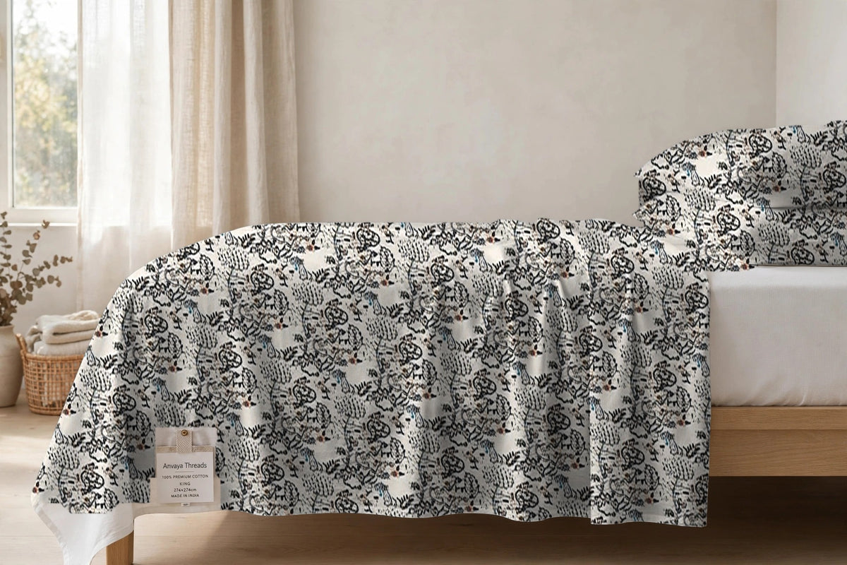 Nakshi Bagh Surmai bedsheet seen from the side, falling over the edge of the bed