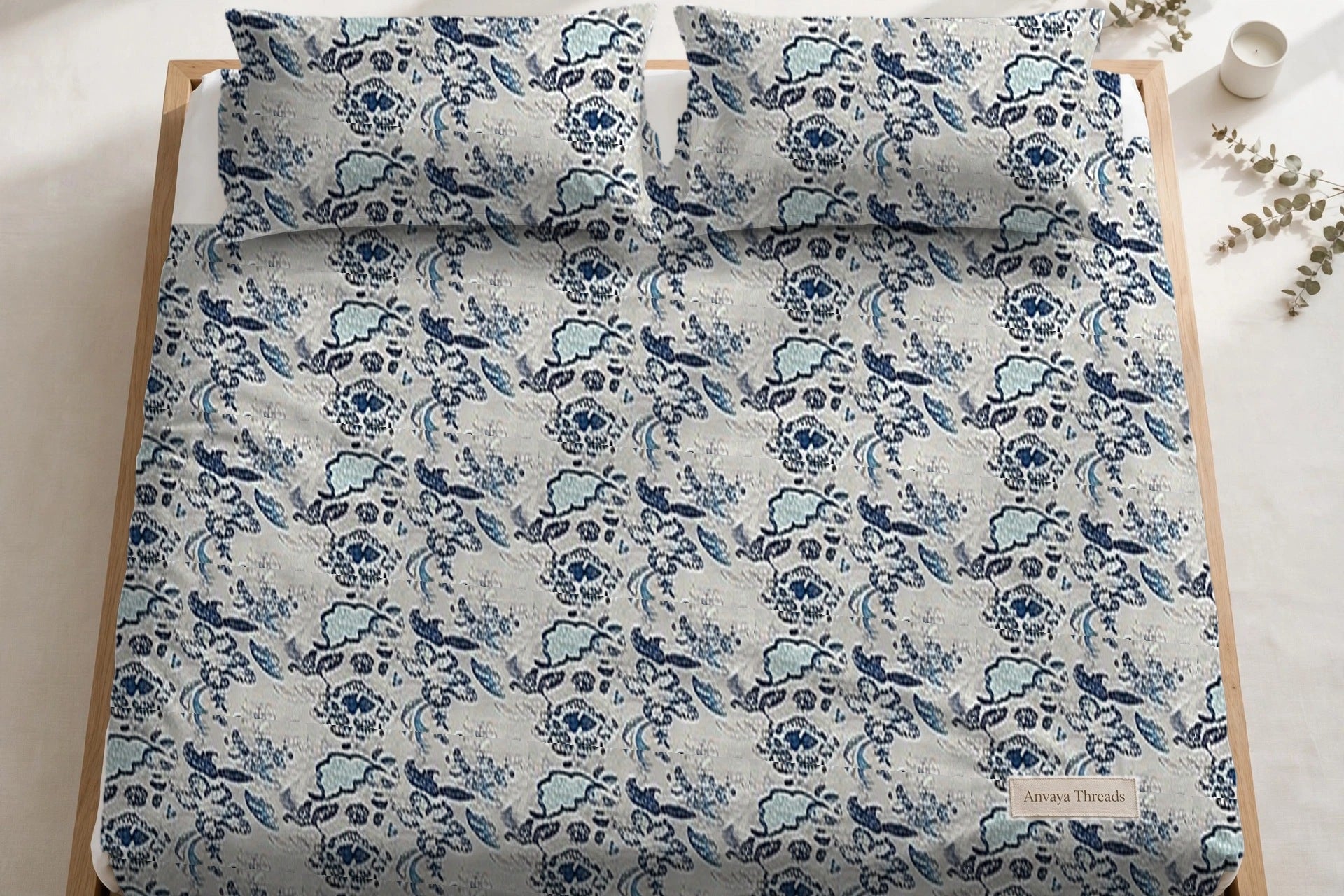 Kalamkari Neel bedsheet seen from above, with the pillow covers at the head of the bed