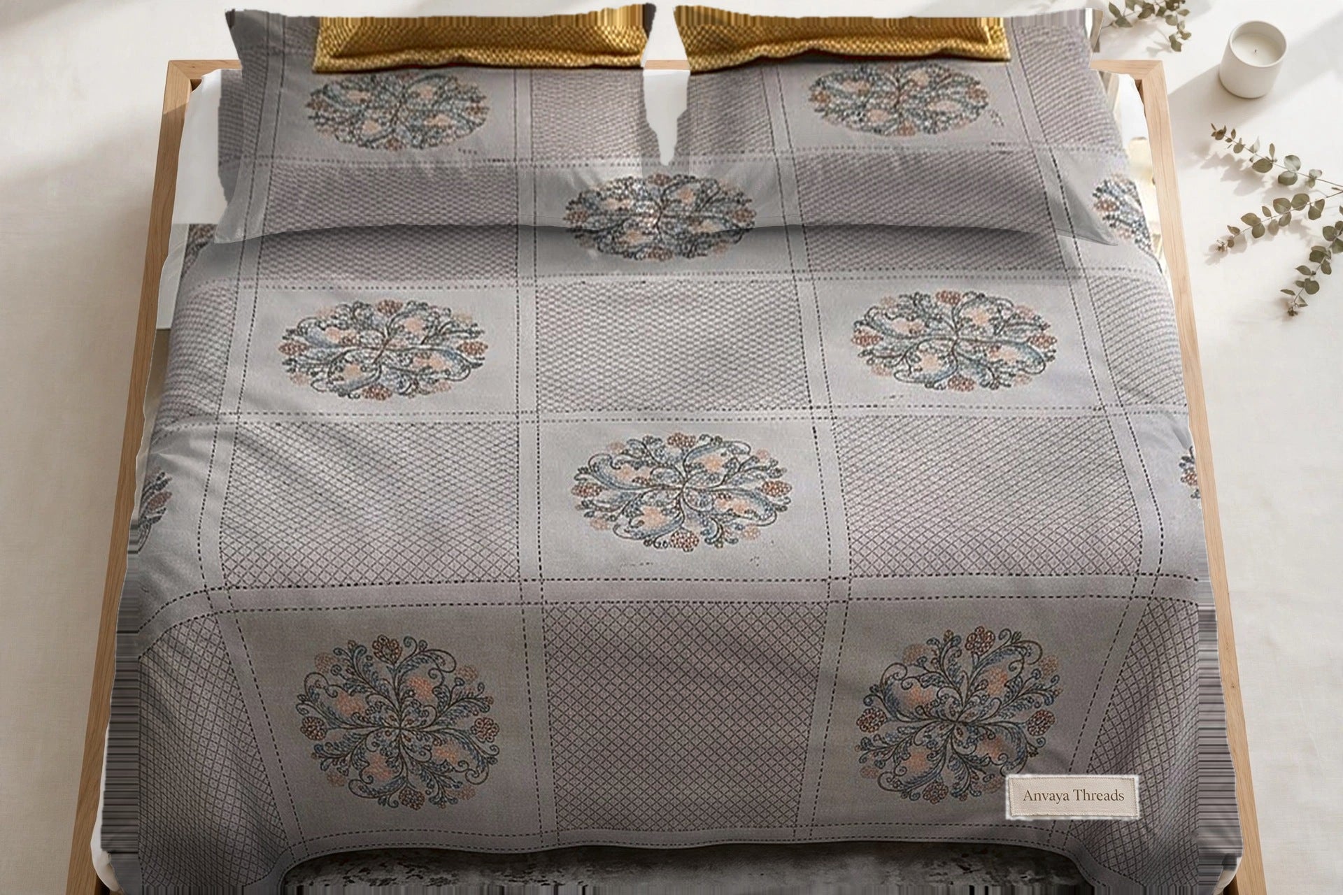 Chowk Mandala Surmai bedsheet seen from above, with the pillow covers at the head of the bed
