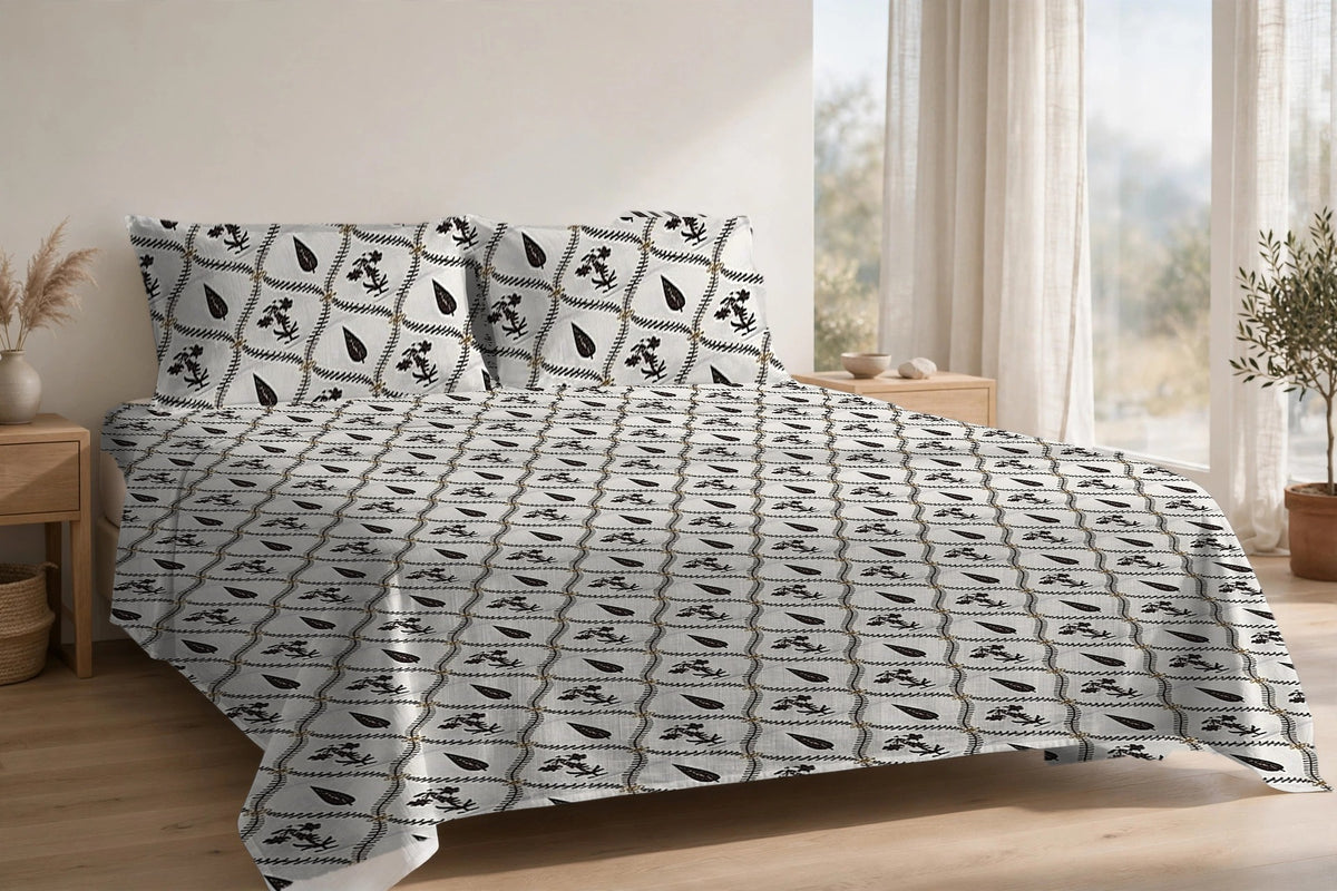 Patti Jaal Kaala cotton bedsheet on a made king bed, with matching pillow covers