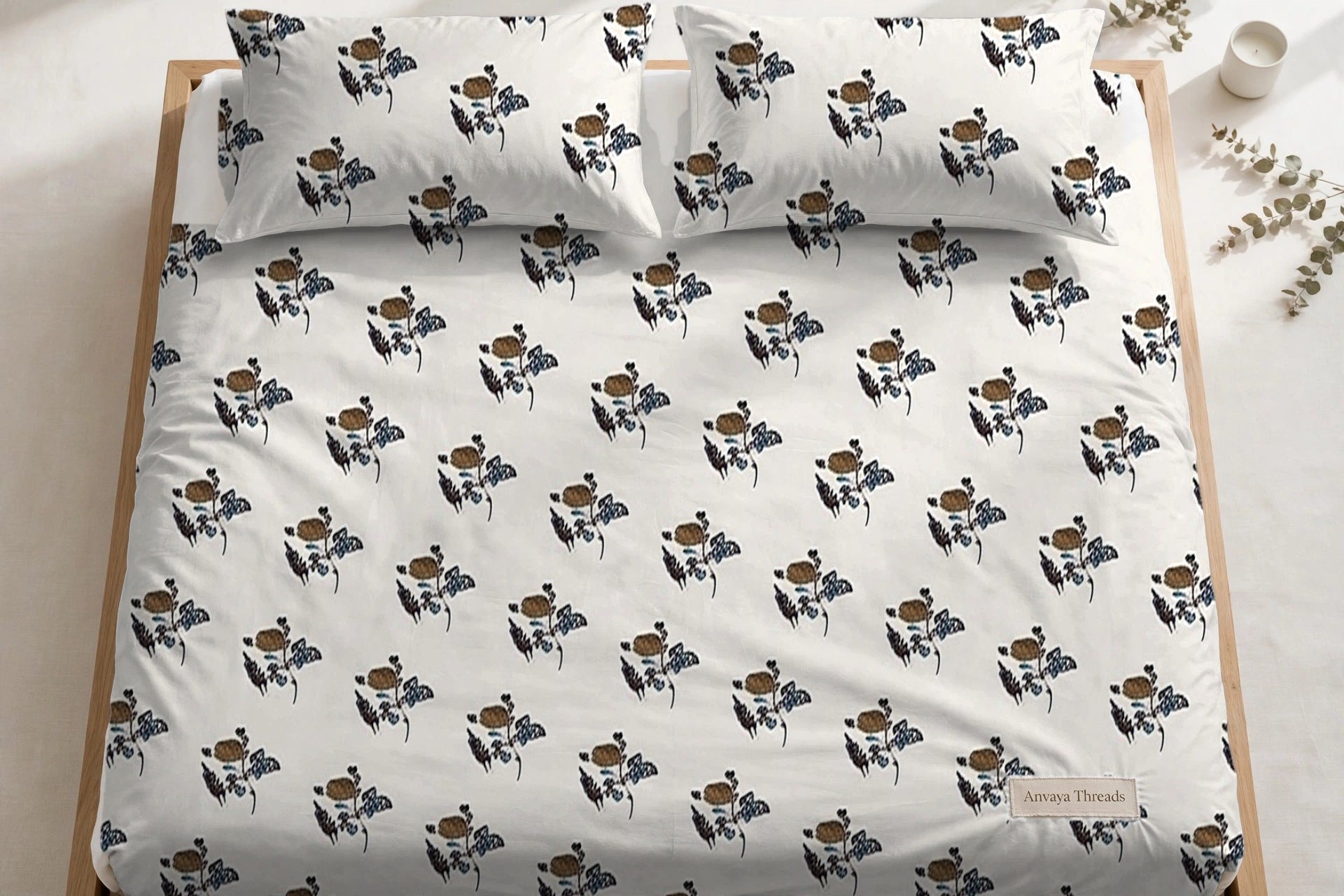 Gulab Kali Firoza bedsheet seen from above, with the pillow covers at the head of the bed