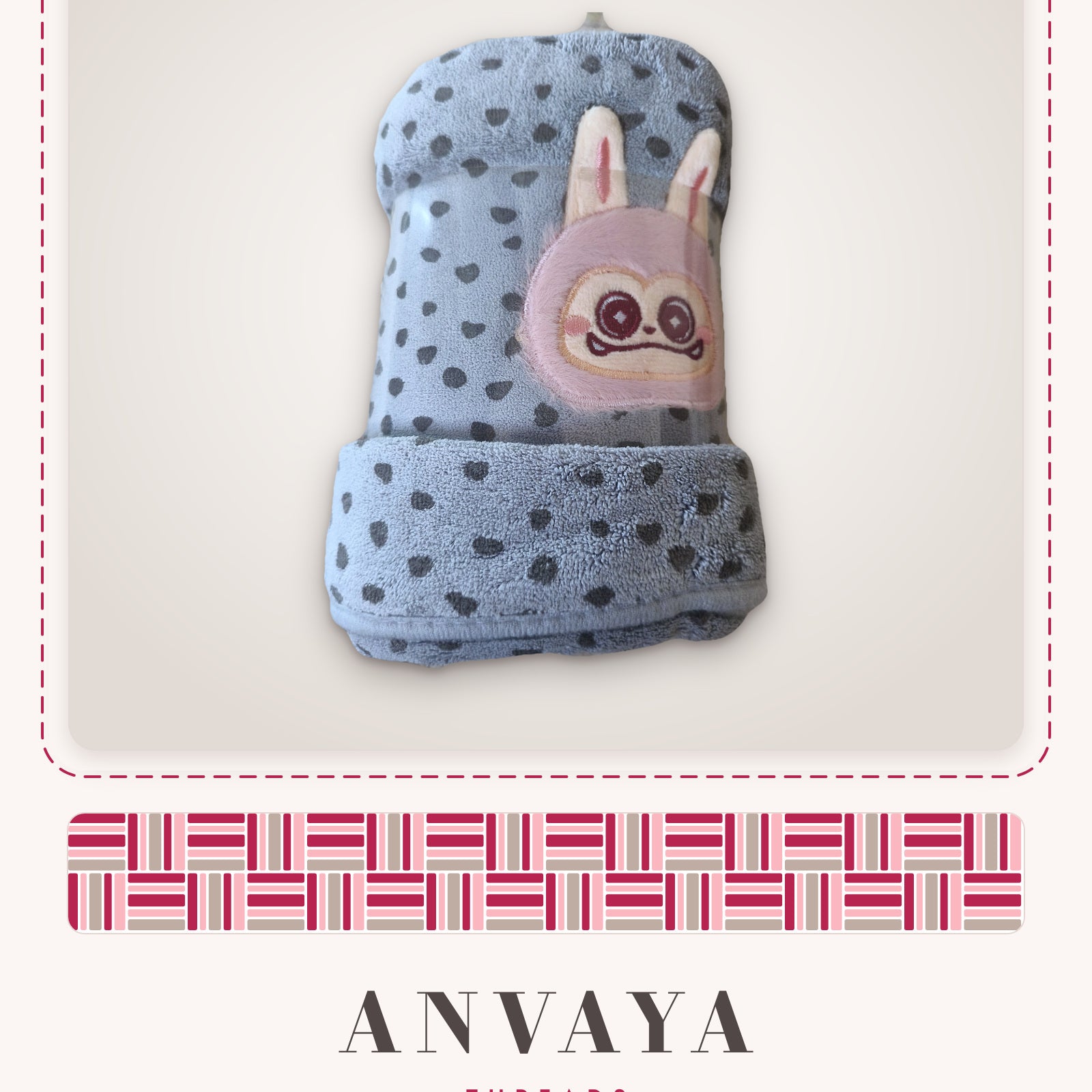 Dove Grey Heart-Spot Bunny kids' hand towel, rolled in a clear wrap with a bunny patch