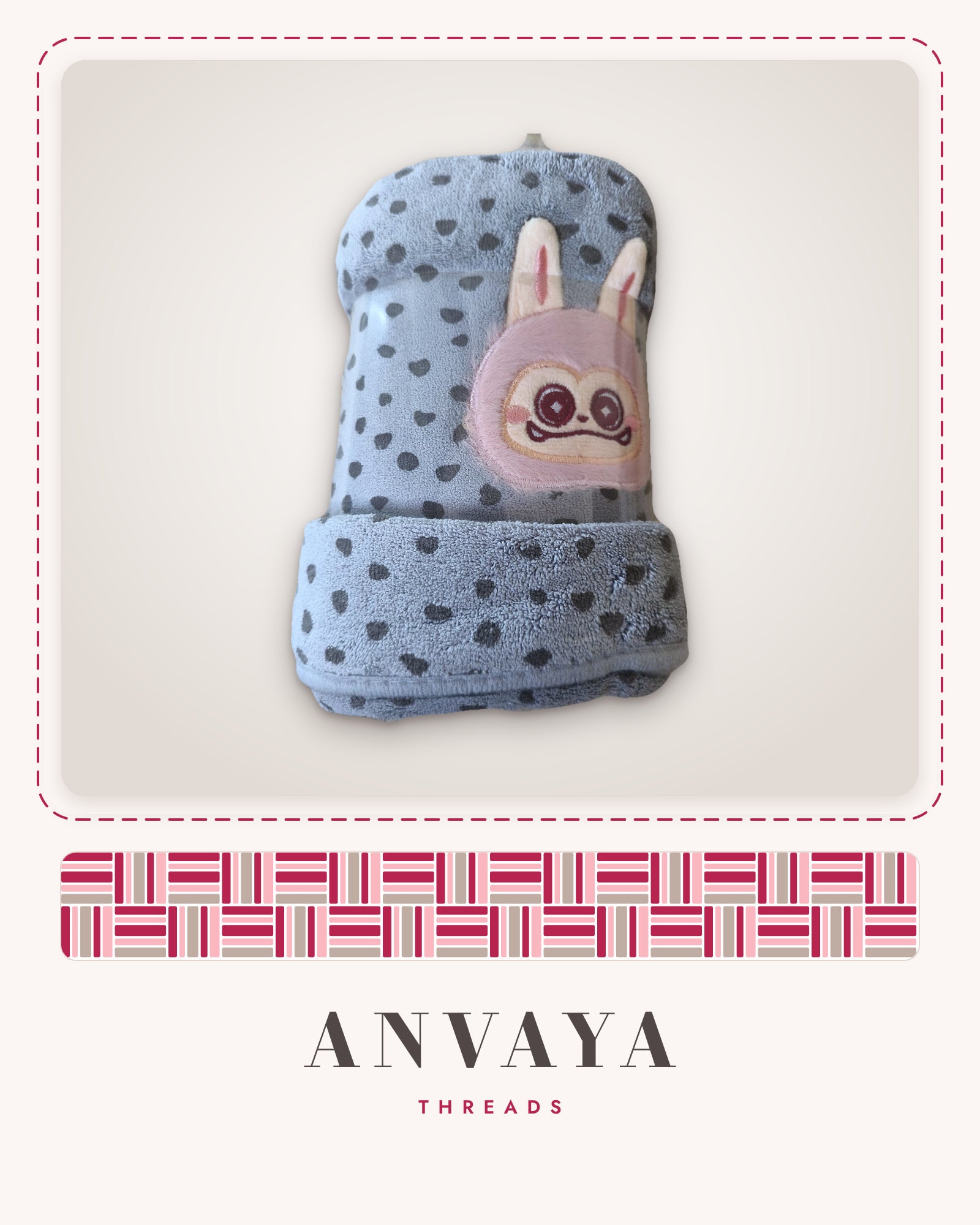 Dove Grey Heart-Spot Bunny kids' hand towel, rolled in a clear wrap with a bunny patch