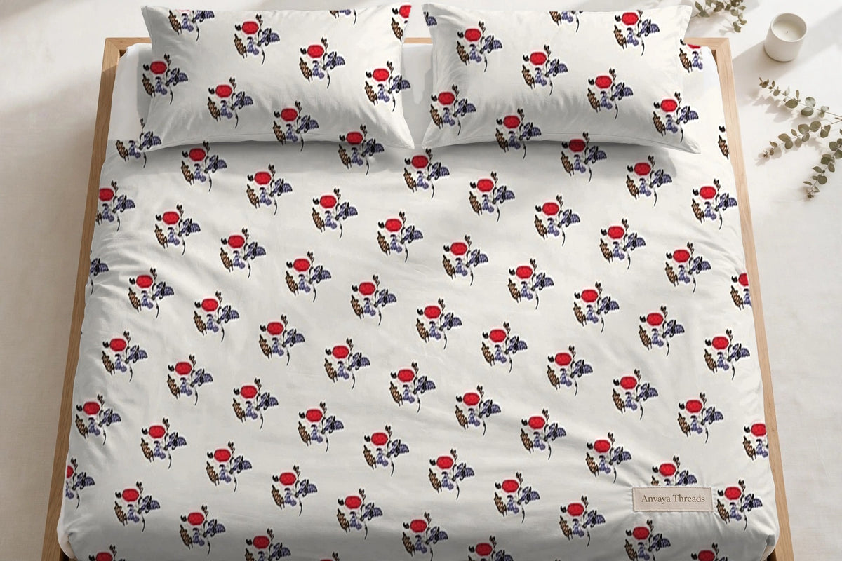 Gulab Kali Neel bedsheet seen from above, with the pillow covers at the head of the bed