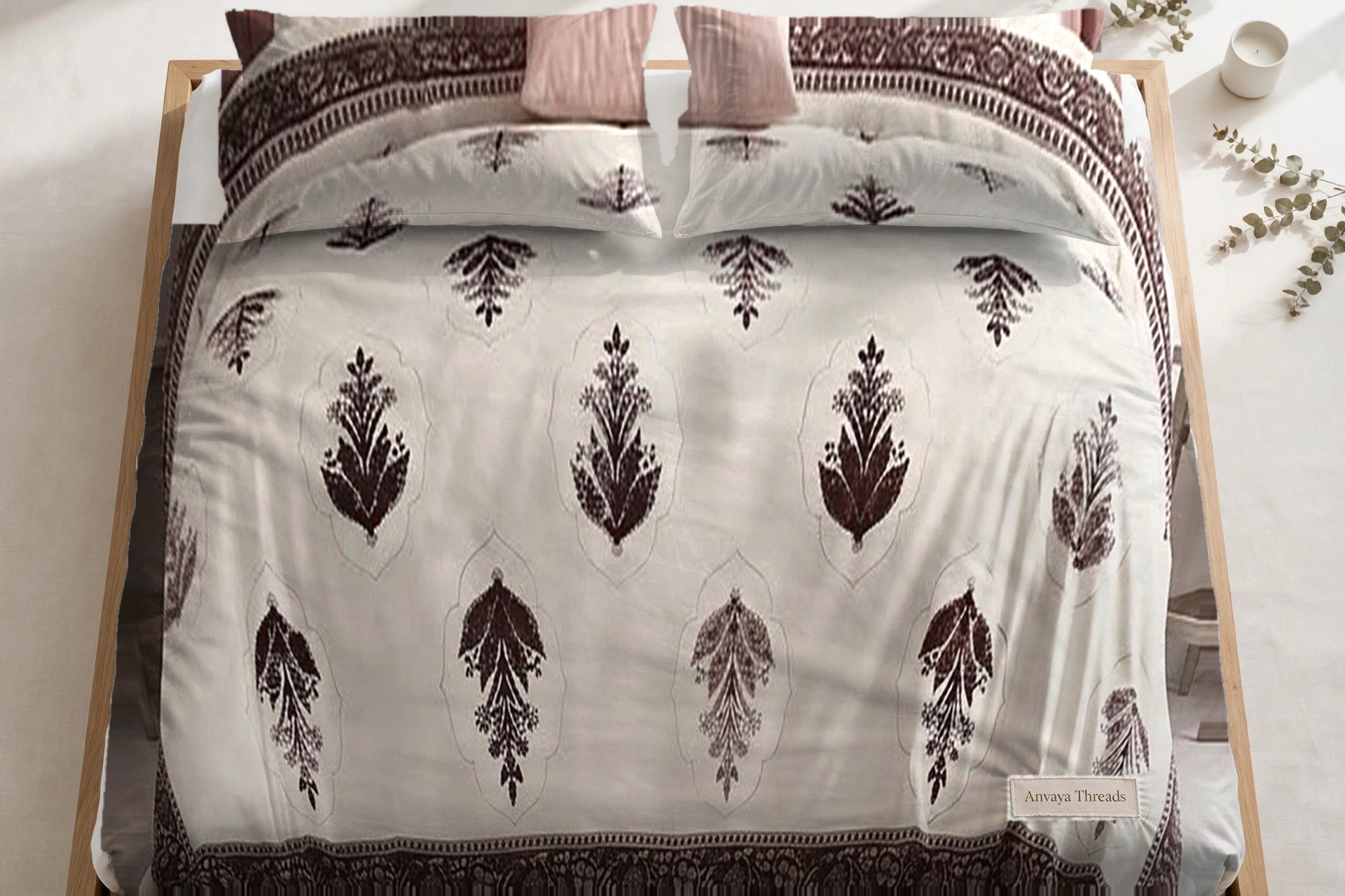 Mehrab Booti Kaapi bedsheet seen from above, with the pillow covers at the head of the bed
