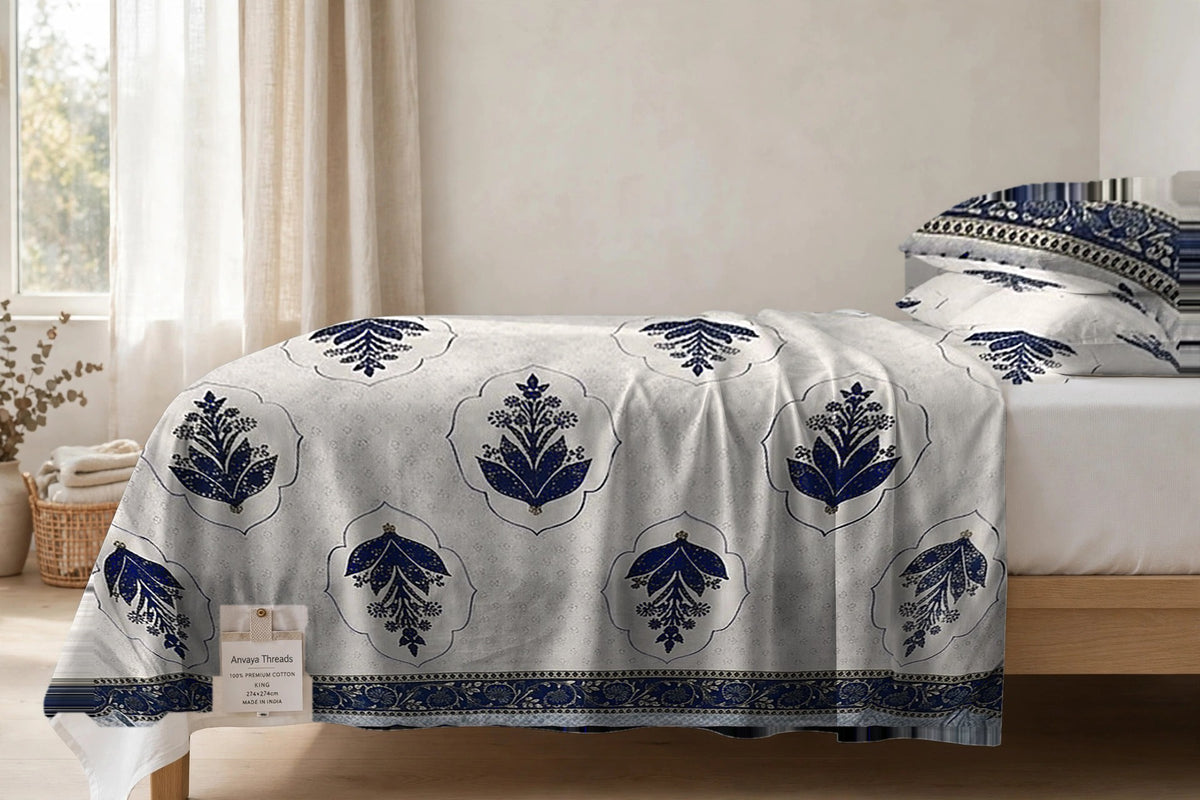 Mehrab Booti Neel bedsheet seen from the side, falling over the edge of the bed
