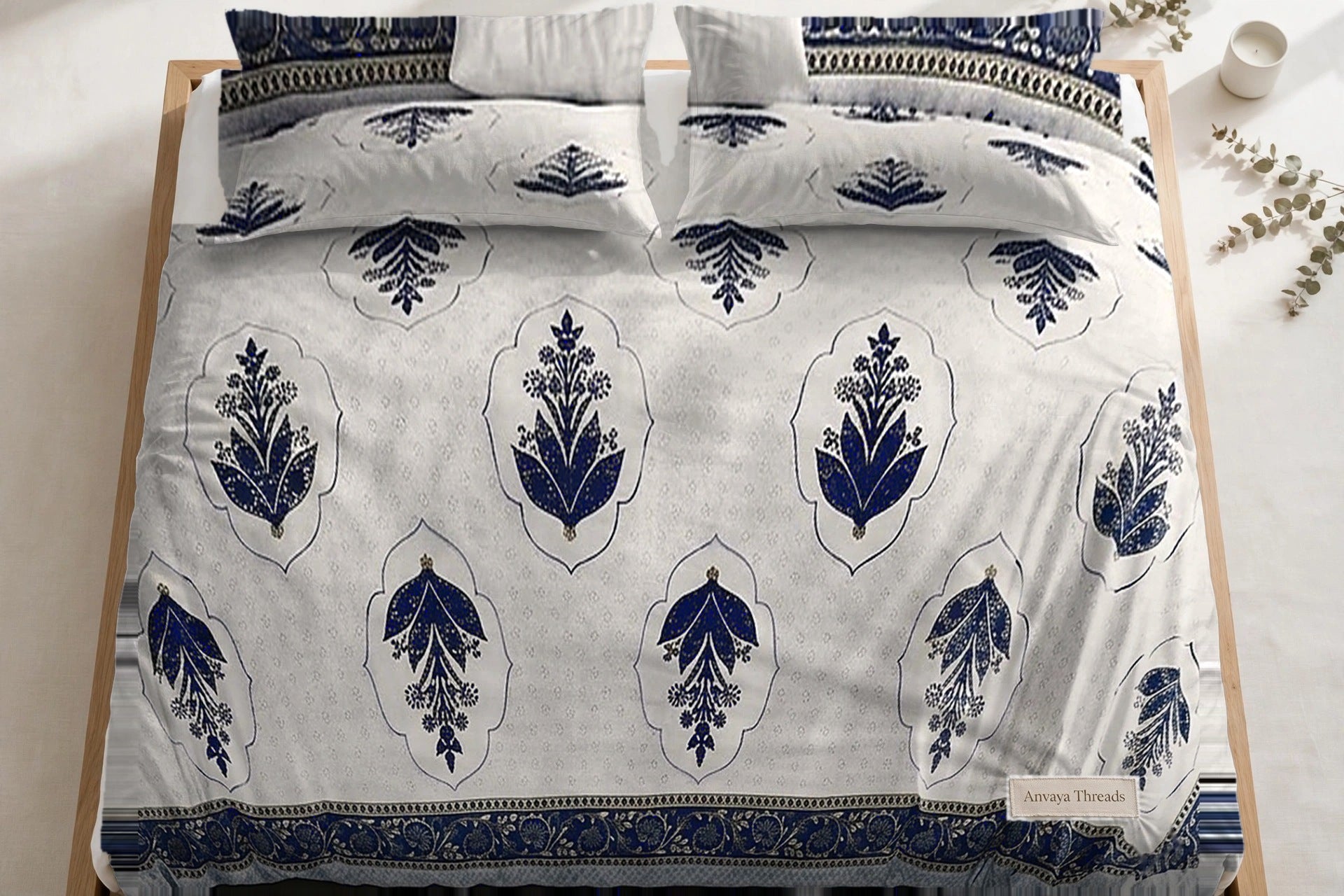 Mehrab Booti Neel bedsheet seen from above, with the pillow covers at the head of the bed