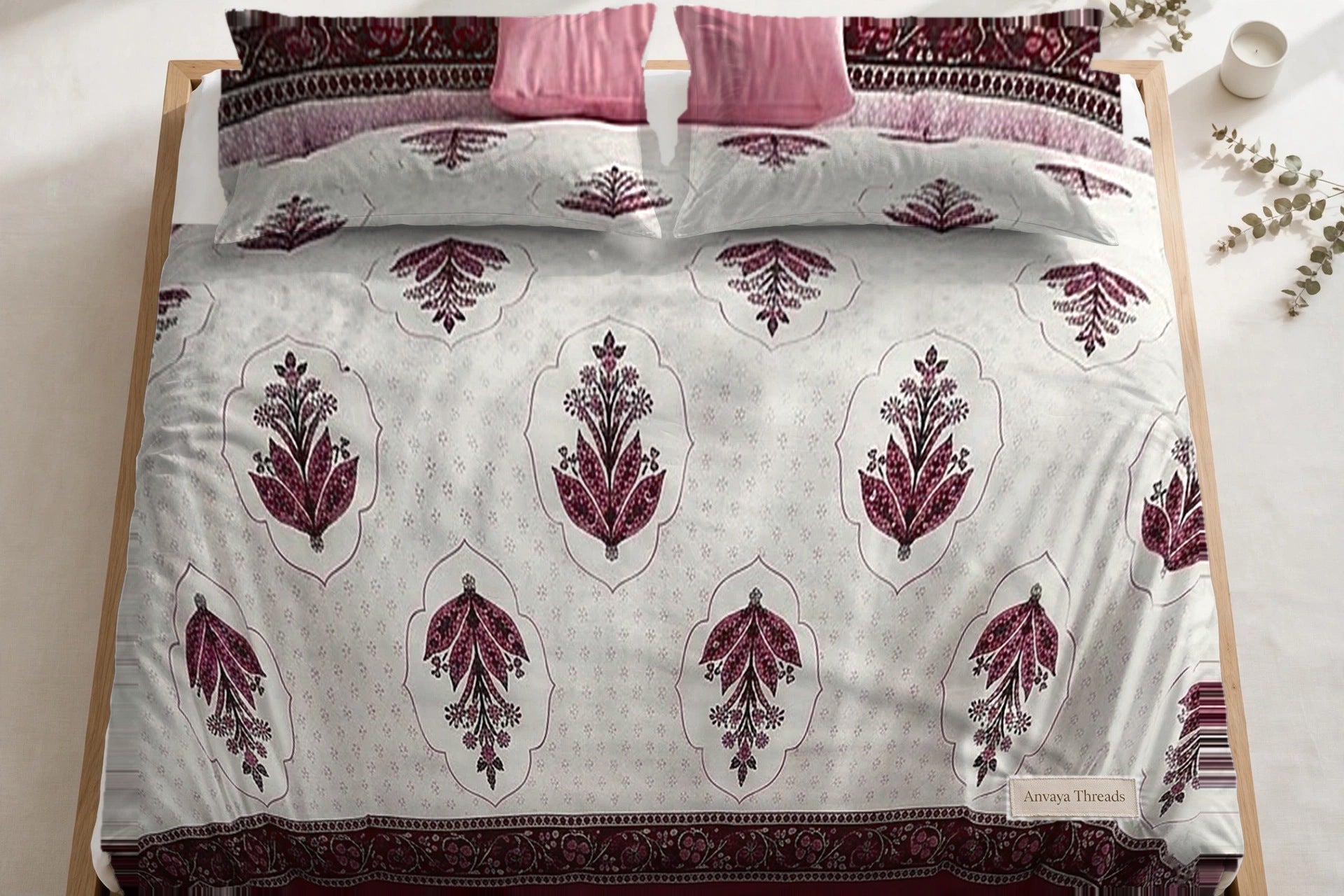 Mehrab Booti Anar bedsheet seen from above, with the pillow covers at the head of the bed