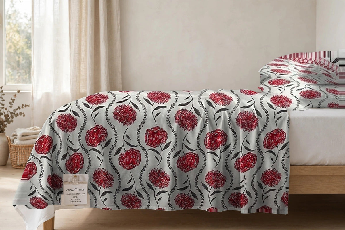 Gulab Bel Anar bedsheet seen from the side, falling over the edge of the bed