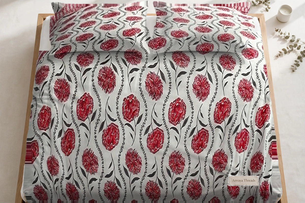 Gulab Bel Anar bedsheet seen from above, with the pillow covers at the head of the bed