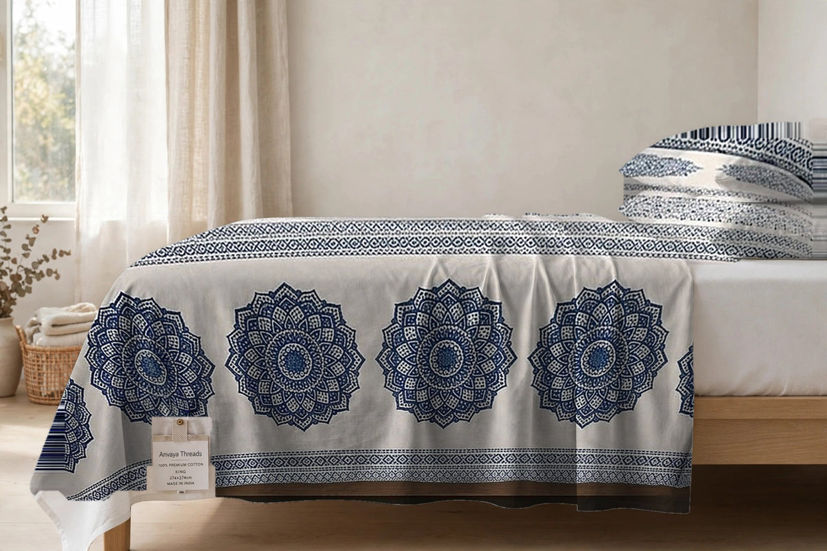 Chakra Mandala Neel bedsheet seen from the side, falling over the edge of the bed