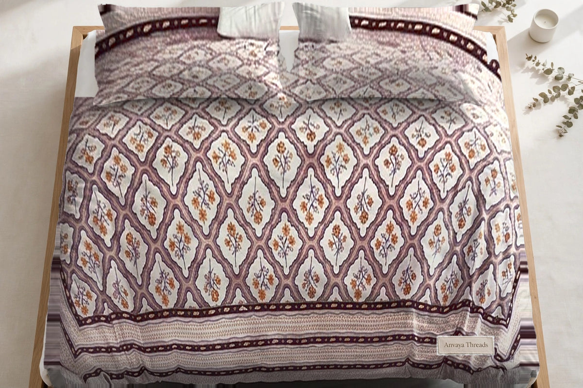 Jharokha Jaal Gulab bedsheet seen from above, with the pillow covers at the head of the bed
