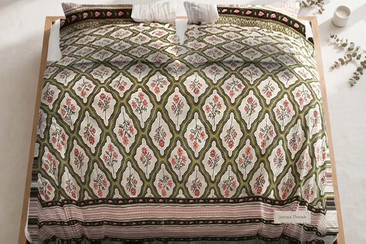Jharokha Jaal Mehndi bedsheet seen from above, with the pillow covers at the head of the bed