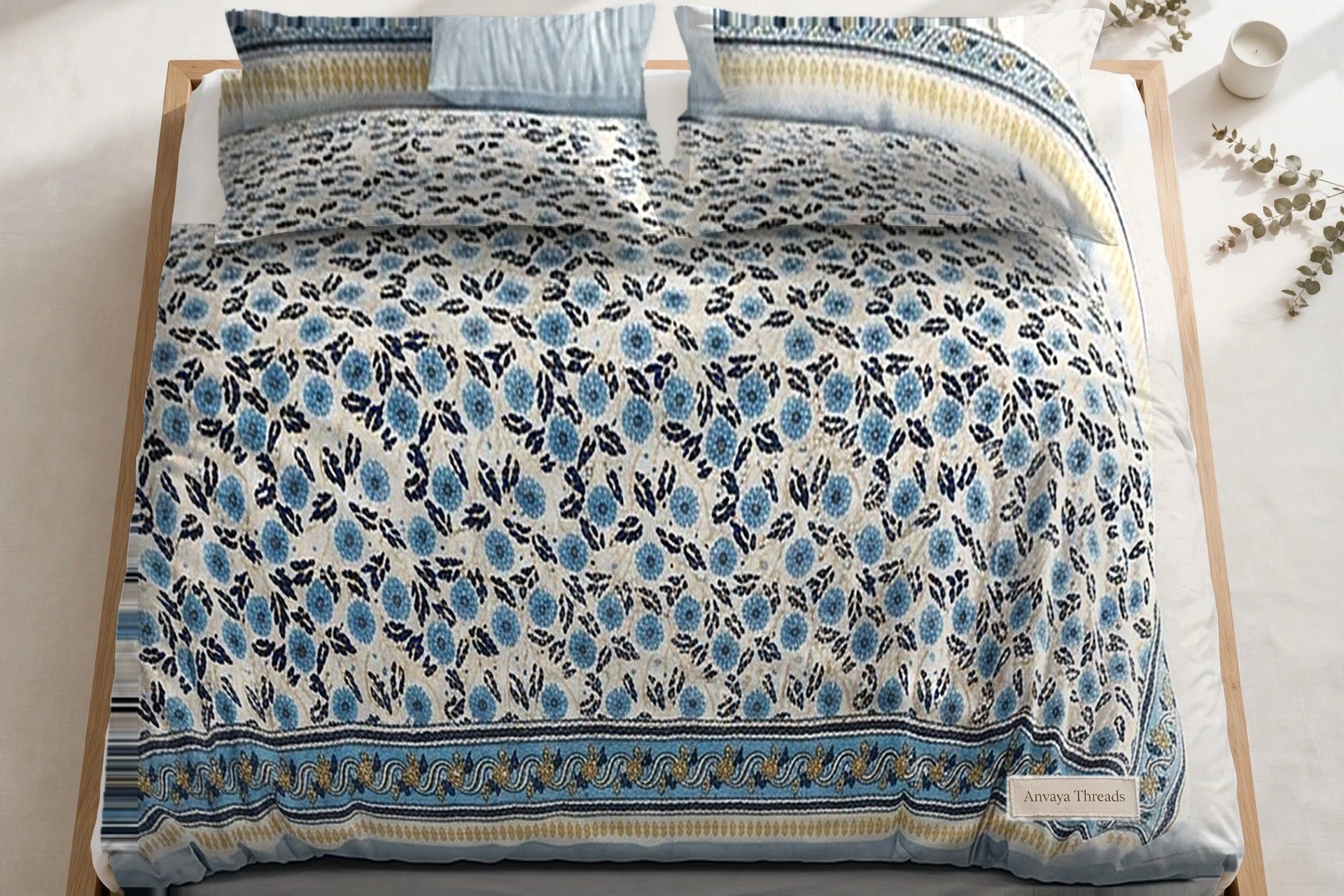 Phulwari Aasmani bedsheet seen from above, with the pillow covers at the head of the bed