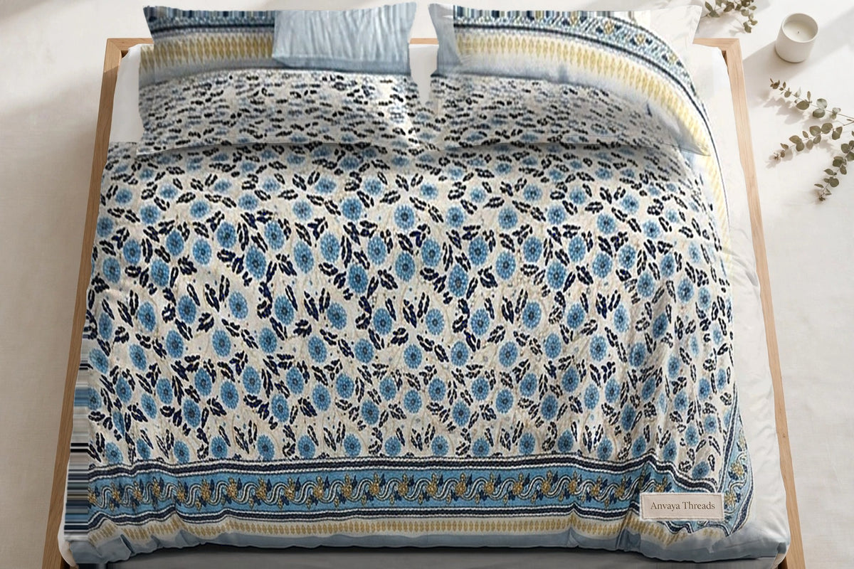 Phulwari Aasmani bedsheet seen from above, with the pillow covers at the head of the bed