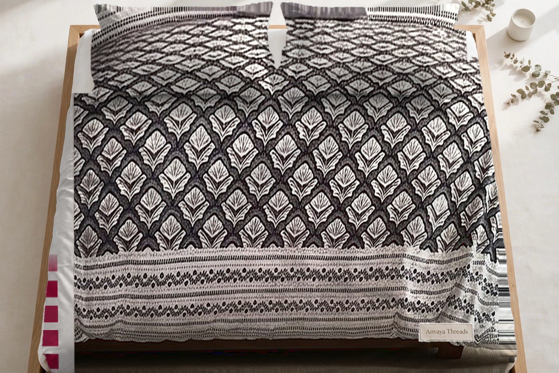 Chaupar Jaal Kajal bedsheet seen from above, with the pillow covers at the head of the bed
