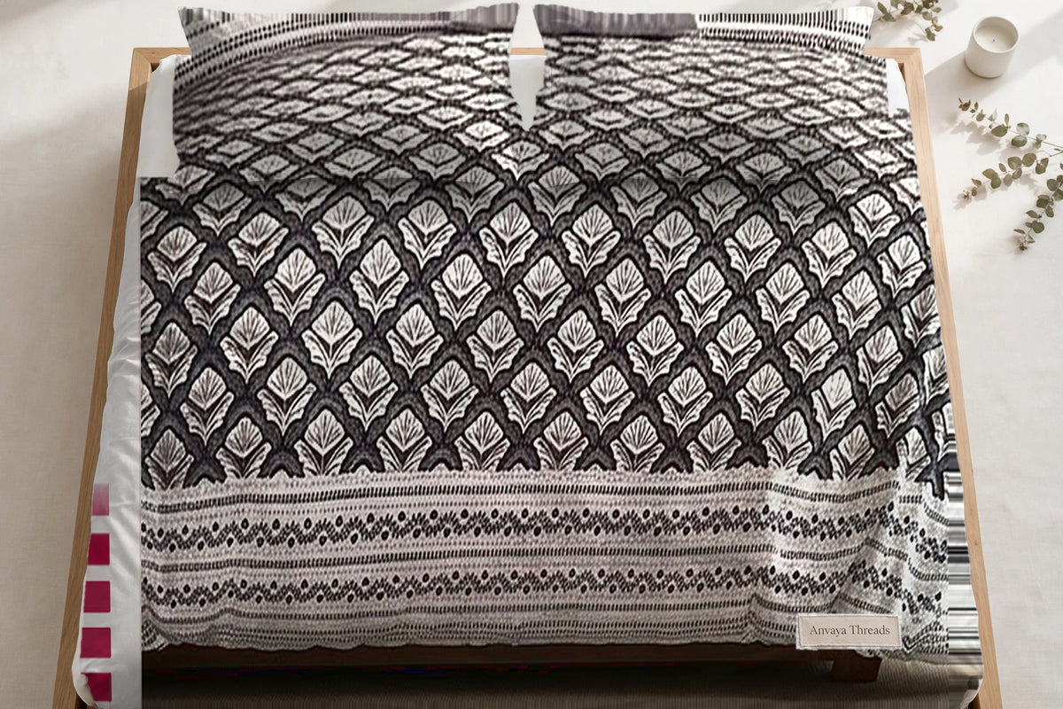 Chaupar Jaal Kajal bedsheet seen from above, with the pillow covers at the head of the bed