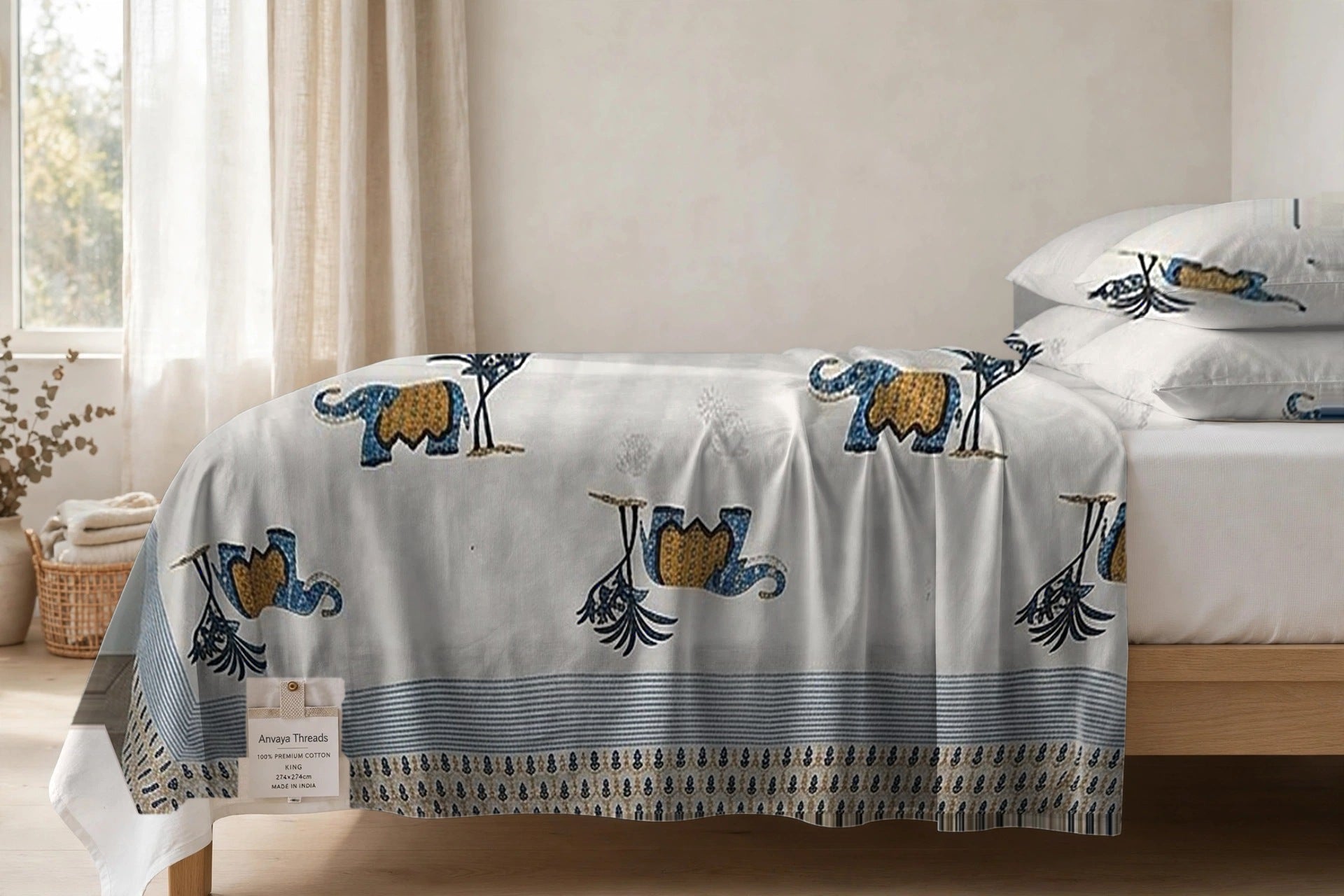Hathi Sawari Neel bedsheet seen from the side, falling over the edge of the bed