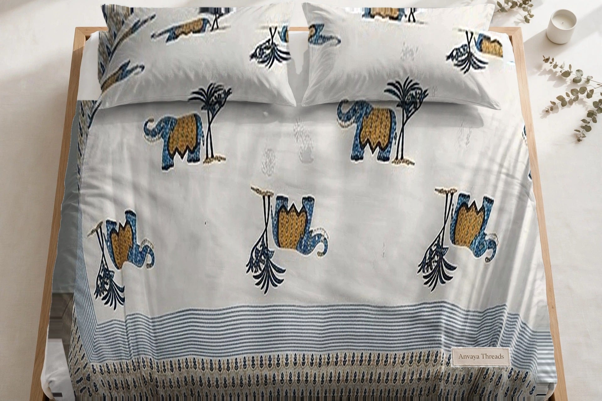 Hathi Sawari Neel bedsheet seen from above, with the pillow covers at the head of the bed