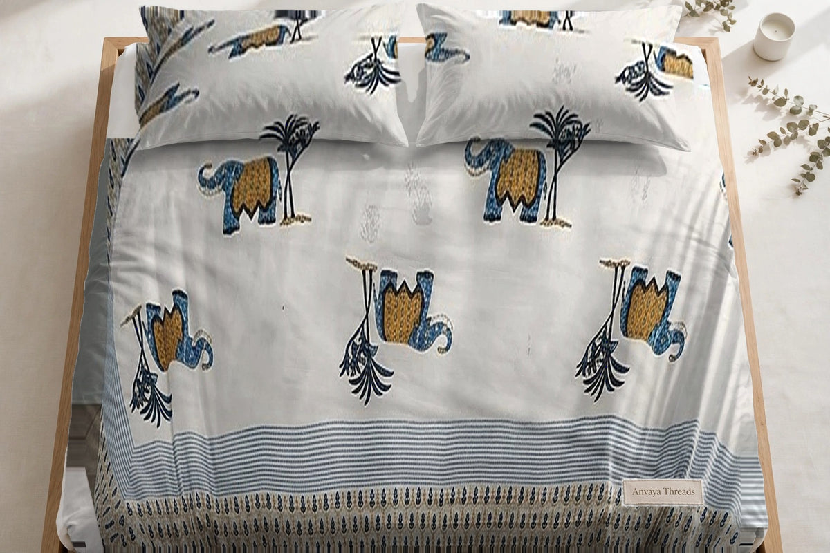 Hathi Sawari Neel bedsheet seen from above, with the pillow covers at the head of the bed