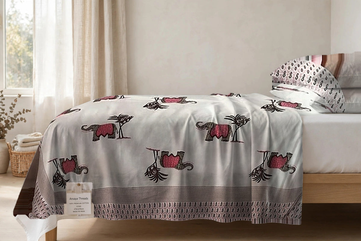 Hathi Sawari Gulab bedsheet seen from the side, falling over the edge of the bed