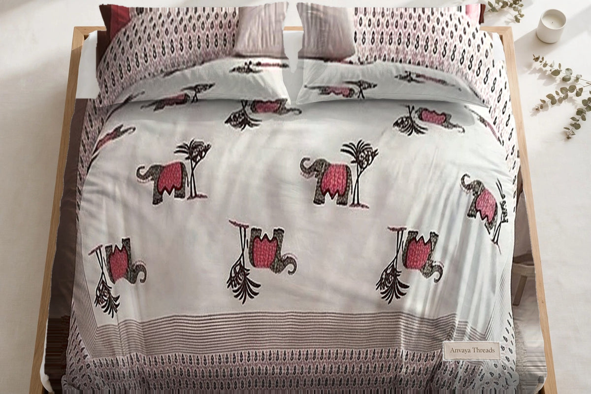 Hathi Sawari Gulab bedsheet seen from above, with the pillow covers at the head of the bed