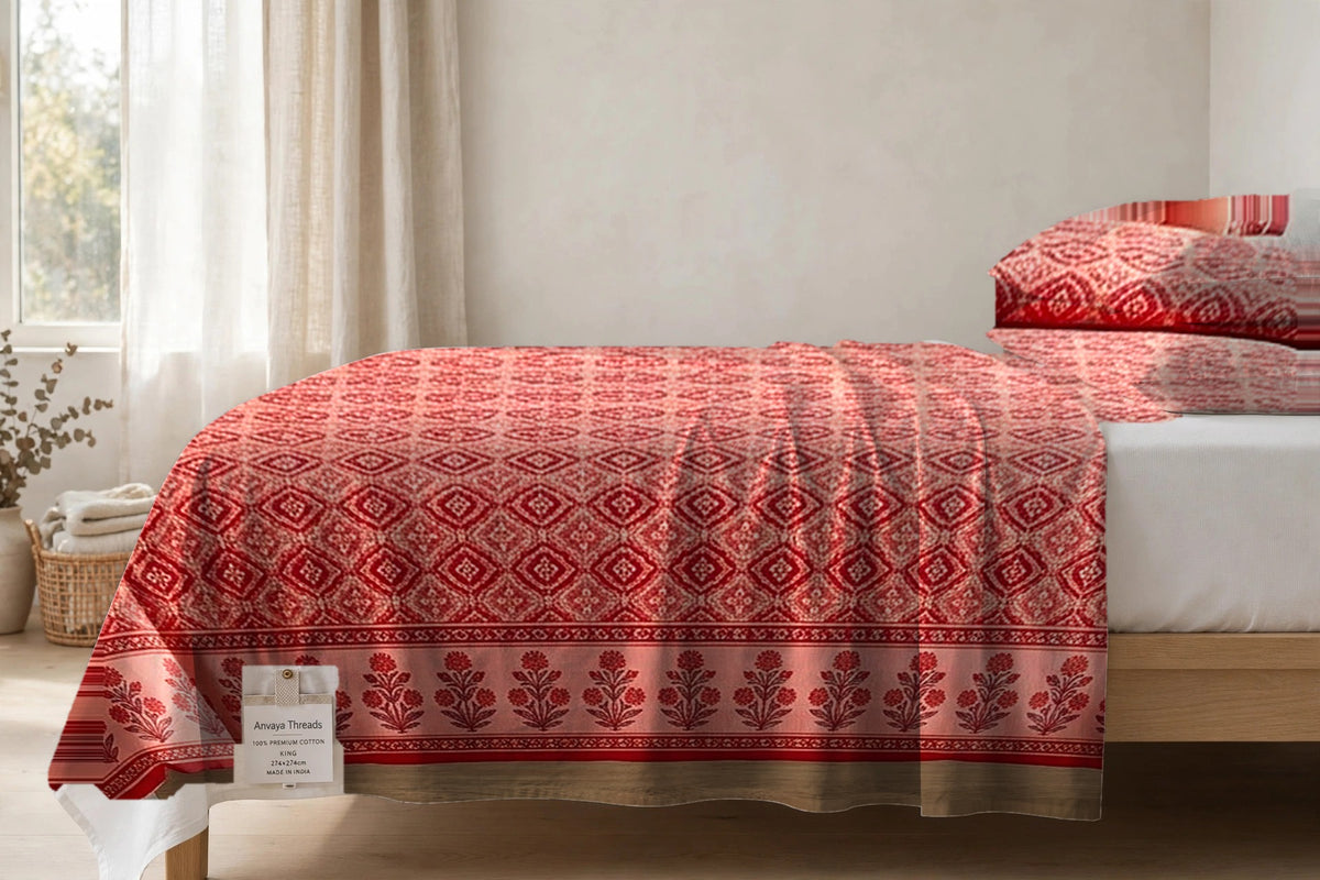 Kinari Booti Sindoor bedsheet seen from the side, falling over the edge of the bed