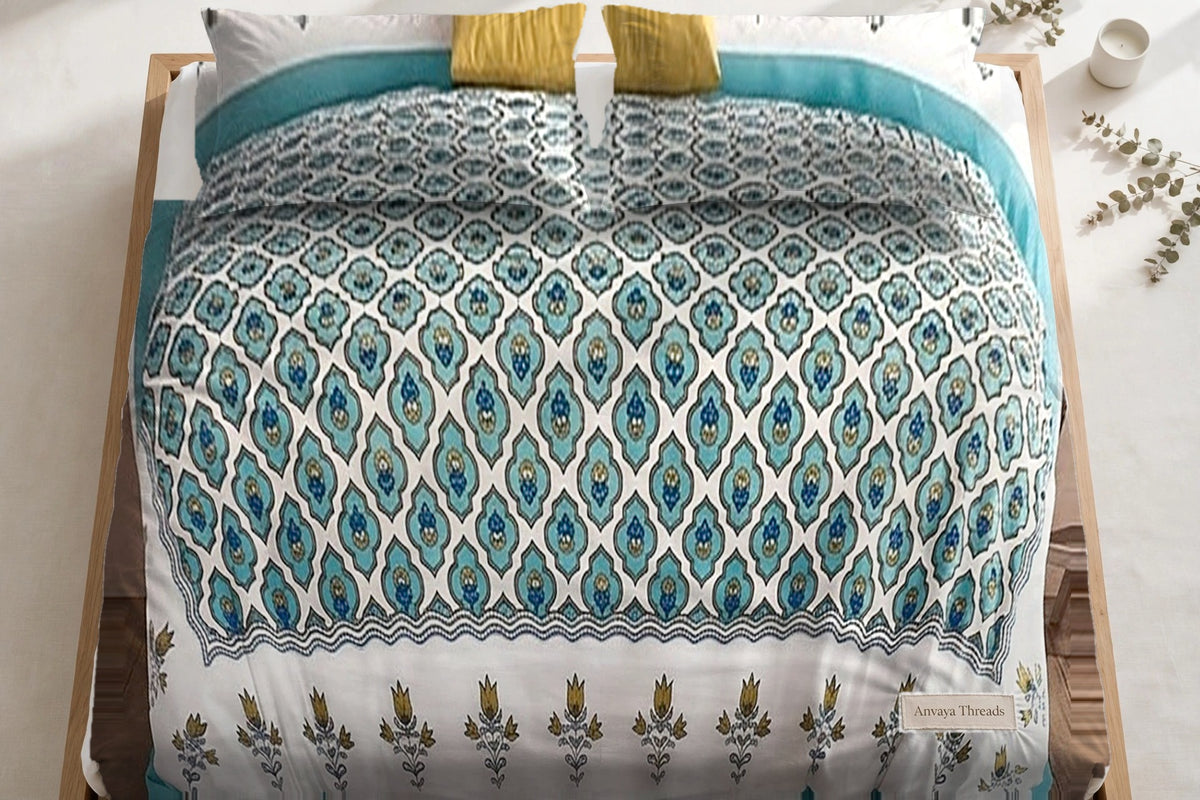 Pankh Jaal Firoza bedsheet seen from above, with the pillow covers at the head of the bed