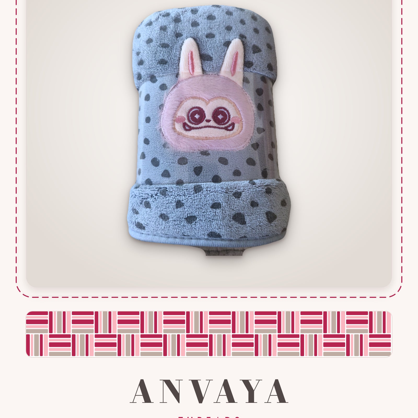 Slate Blue Dot Bunny kids' hand towel, rolled in a clear wrap with a bunny patch
